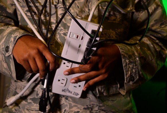 Remember that devices such as televisions, computers, and DVD players can still use energy when turned, plug these devices into a power strip and turn the power strip off to avoid excess usage. (U.S. Air Force photo by Airman 1st Class Christian Clausen/Released)