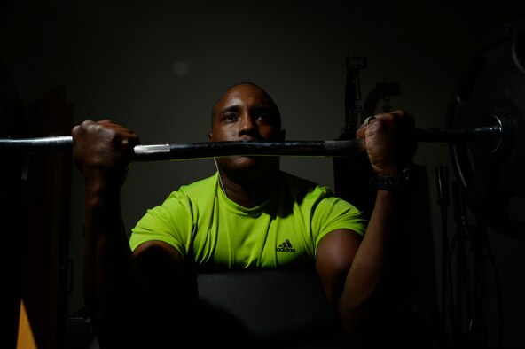 Tech. Sgt. Brian, 432nd Wing/432nd Air Expeditionary Wing commanders action group NCO in charge, performs barbell curls April 13, 2015, at Creech Air Force Base, Nevada. Having a regular fitness regimen is an effective way to boost energy levels as long as sleep has not been deprived. (U.S. Air Force photo by Airman 1st Class Christian Clausen/Released)