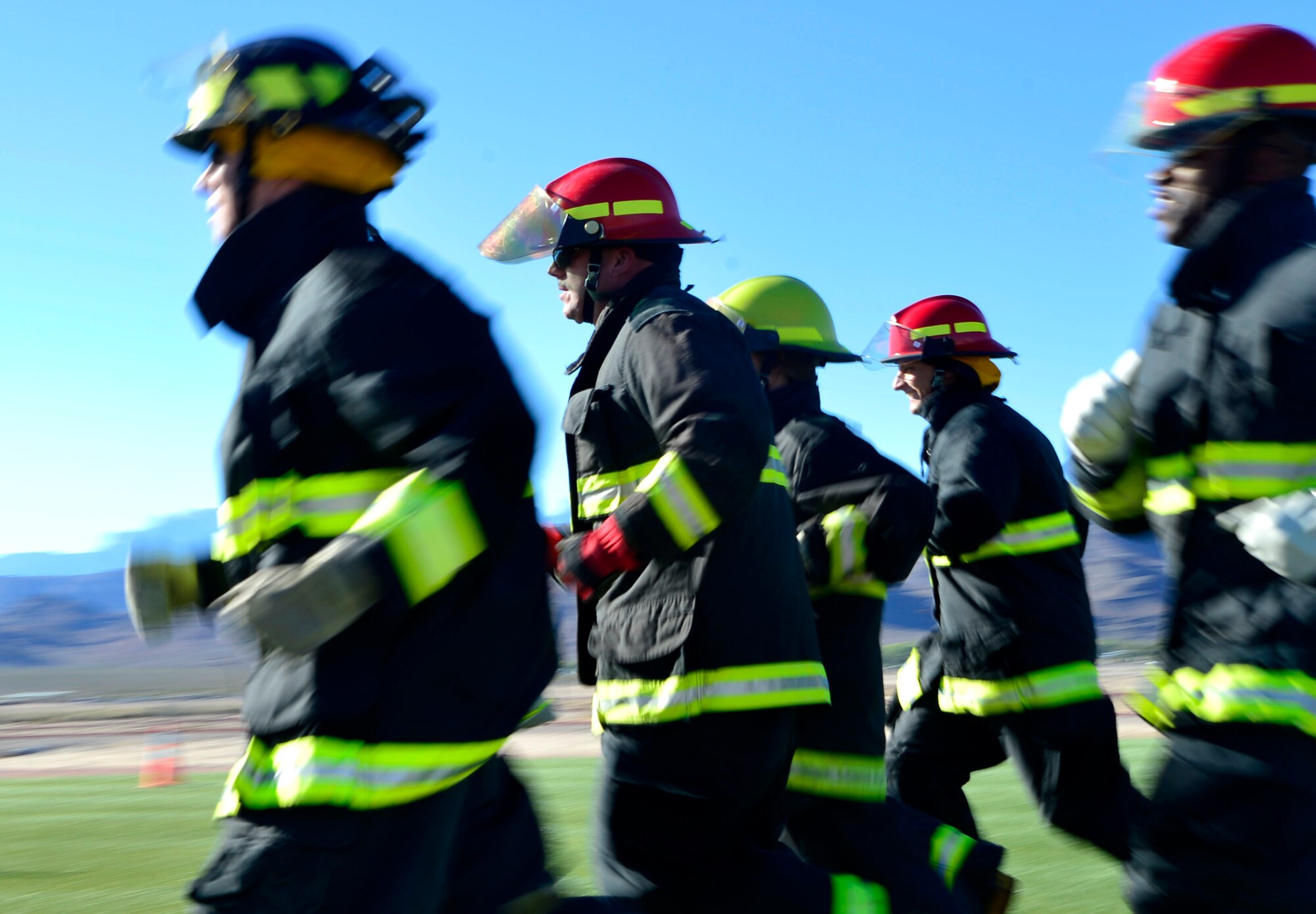 Members of Team Creech compete in the 5th annual Fire Muster Oct. 9, 2015, at Creech Air Force Base, Nevada. The Fire Muster challenged over 12 teams in a series of firefighter related obstacles.(U.S. Air Force photo by Airman 1st Class Christian Clausen/Released)