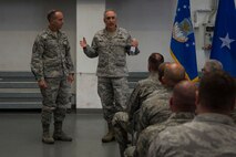 U.S. Air Force Chief Master Sgt. Pete Stone, USAF Expeditionary Center command chief, left, and U.S. Air Force Maj. Gen. Frederick Martin, USAF Expeditionary Center commander, speak to members of the 52nd Fighter Wing during a 726th Air Mobility Squadron all call at Spangdahlem Air Base, Germany, Oct. 14, 2015. Martin discussed future changes Airmen can anticipate and also answered any questions Airmen presented. (U.S. Air Force photo by Airman 1st Class Luke Kitterman/Released) 