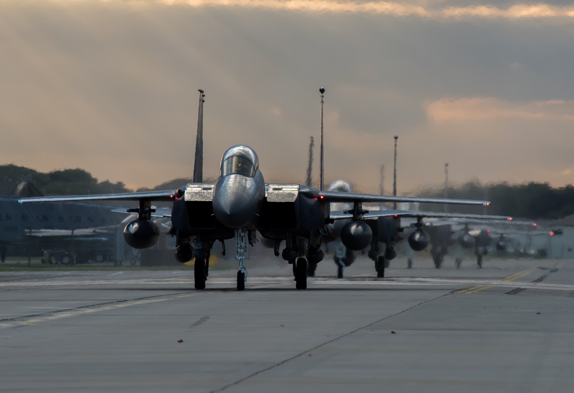F-15E Strike Eagles assigned to the 494th Fighter Squadron, taxi down the runway at Royal Air Force Lakenheath, England, Oct. 9, 2015. While deployed, the Panthers flew 1,651 sorties and dropped more than 1,700 bombs in support of U.S. Central Command operations. (U.S. Air Force photo by Senior Airman Trevor T. McBride/Released)