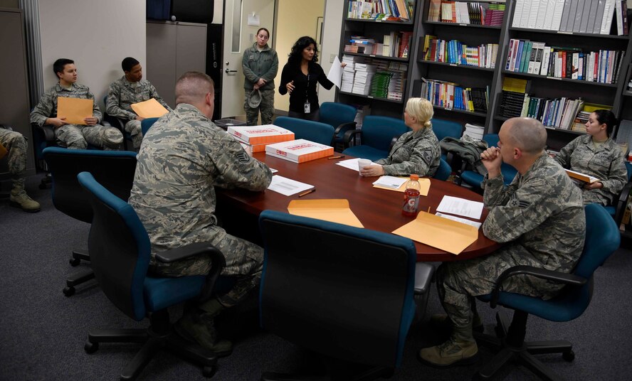 Rosanne Pizano, 35th Medical Operations Squadron domestic abuse victim advocate, speaks to volunteers at Misawa Air Base, Japan, Oct. 15, 2015. The topic of discussion is the ?In Your Face Black Eye Campaign,? an exercise conducted in support of Domestic Violence Awareness Month. Eleven Airmen and one civilian from different base squadrons volunteered to don black eye makeup during their normal duty day as part of the exercise. (U.S. Air Force photo by Airman 1st Class Jordyn Fetter/Released)