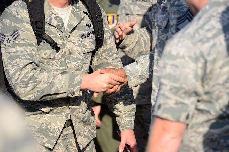 Airmen from the 35th Fighter Wing are greeted by wing leadership upon arrival at Misawa Air Base, Japan, Oct. 16, 2015. Airmen from Misawa are often deployed worldwide in support of operations requiring the Wild Weasel mission of suppression of enemy air defenses. (U.S. Air Force photo by Tech. Sgt. April Quintanilla/Released) 
