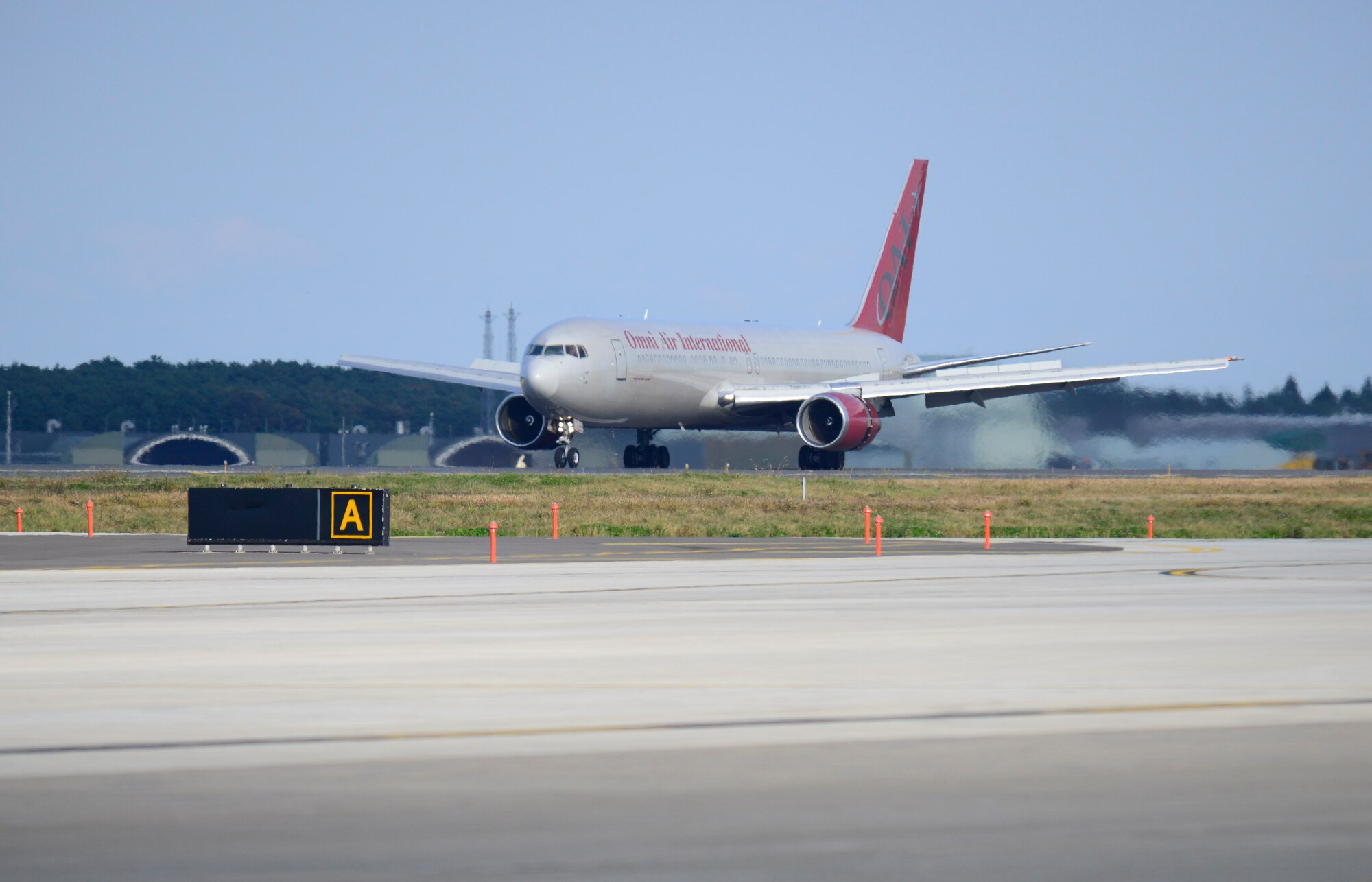 A Boeing 767 touched down on the runway at Misawa Air Base, Japan, Oct.  16, 2015.  The B-767 transported Airmen from the 35th Fighter Wing after a rotational deployment requiring the need of the Wild Weasel mission of suppression of enemy air defenses.. (U.S. Air Force photo by Tech. Sgt. April Quintanilla/Released)