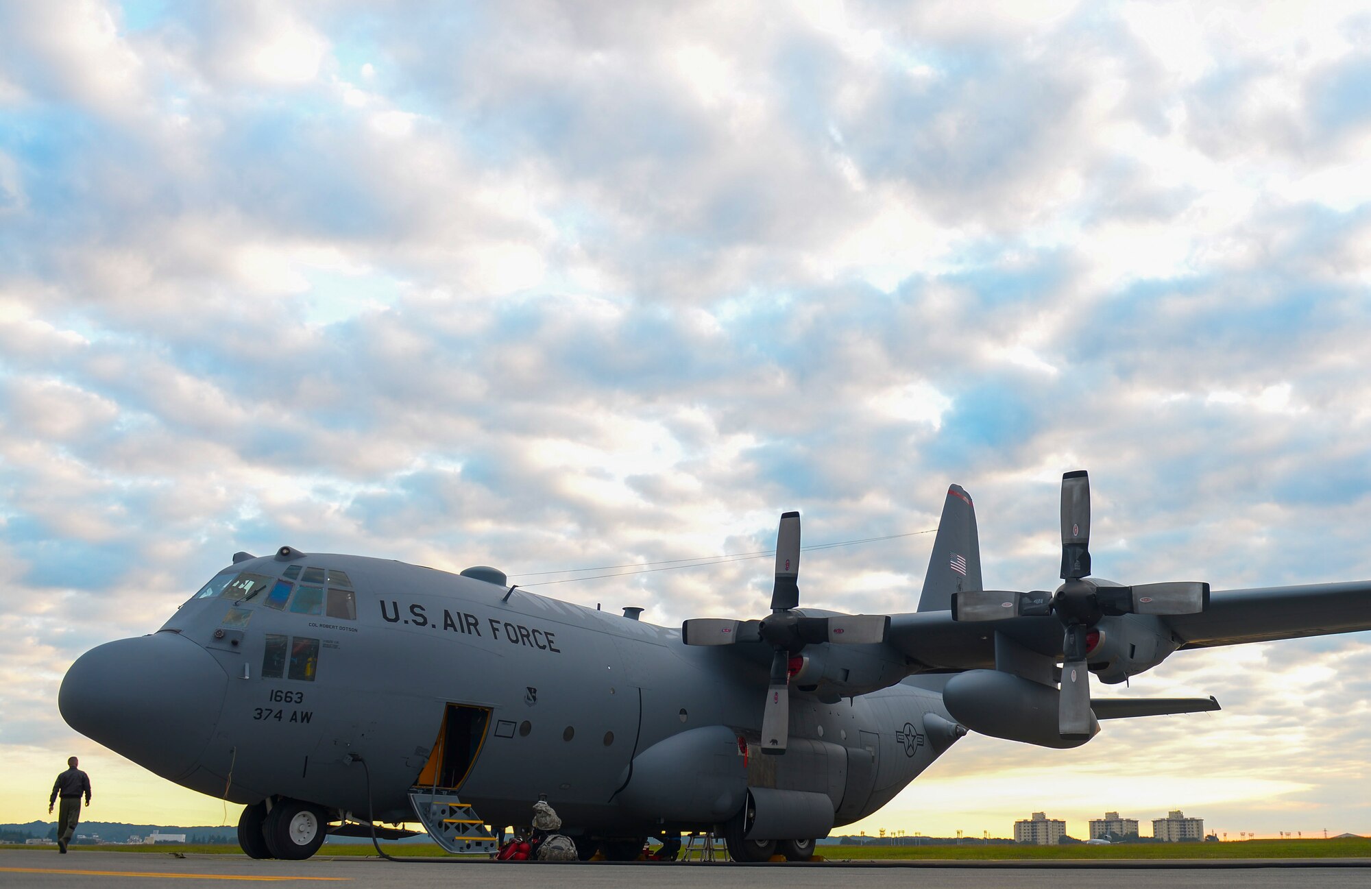 A C-130 Hercules undergoes preparations for flight at Yokota Air Base, Japan, Oct. 14, 2015. Each aircraft is carefully inspected before every flight to ensure the safety and success of the mission. (U.S. Air Force photo by Airman 1st Class Elizabeth Baker/Released)