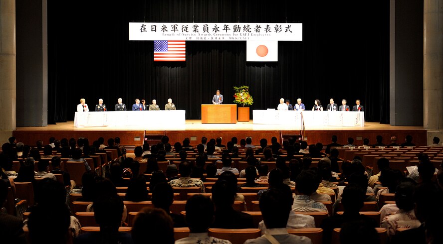 The Okinawa Ministry of Defense along with the U.S. Forces, Japan conduct a Joint Length of Service Award ceremony for long-service employees who have 10, 20, 30 and 40 years of service with USFJ facilities in Okinawa at the Okinawa Convention Center in Ginowan City, Japan, Oct. 15, 2015. The USFJ employees are hired by the Government of Japan (minister of defense) for the purpose of accomplishing the mission of USFJ while working at USFJ facilities. (U.S. Air Force photo by Naoto Anazawa)