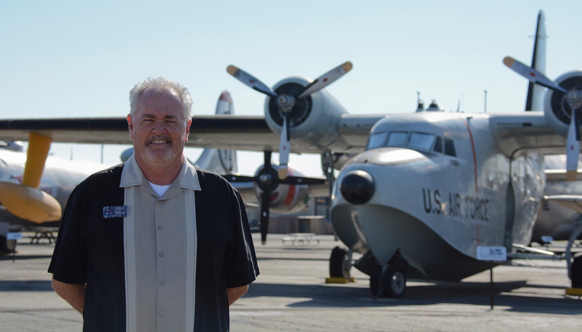 Rick Shea, Travis Heritage Center curator, stands in front of a SA-16 Albatross on Oct. 13 at the heritage center at Travis Air Force Base, Calif. Shea returned to Travis as a civilian employee in July after an active-duty stint at the Bay Area base during the late 1970s. (U.S. Air Force photo by Airman 1st Class Amber Carter)