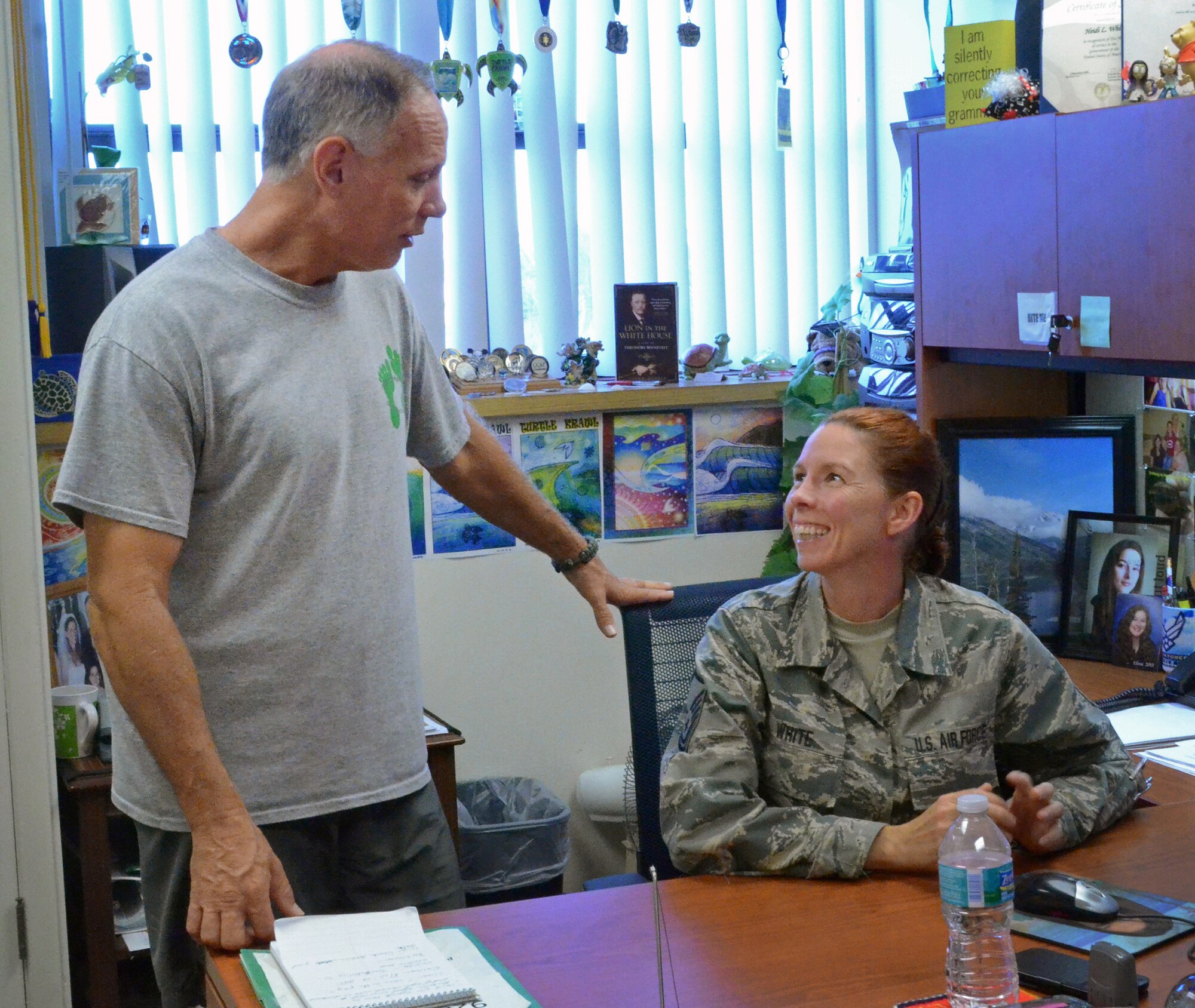 Retired Master Sgt. Derrell White visits his wife, Master Sgt. Heidi White, in her office at the 920th Rescue Wing, Patrick Air Force Base, Fla., Oct. 3, 2015. Derrell, who retired from the Air Force Reserve in 2013, was diagnosed with the chronic kidney condition IgA Nephropathy in 1986. He is now in stage four, meaning his kidneys are operating at below 20 percent of normal, and is seeking a kidney donor to help save his life. Heidi is the unit training manager for the 920th Maintenance Group at Patrick. (U.S. Air Force photo by 2nd Lt. Anna-Marie Wyant)