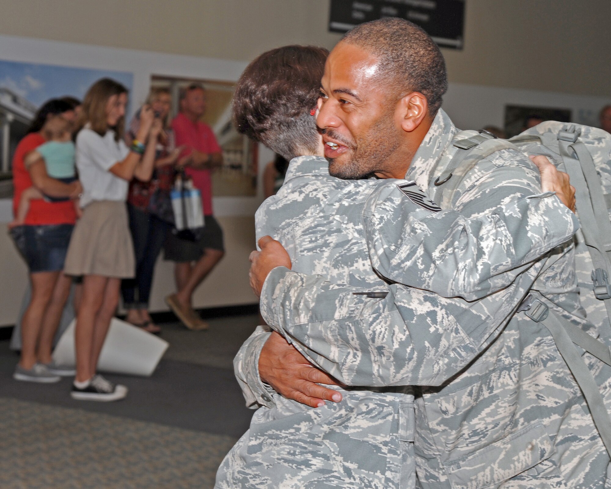 More than two dozen, family members, friends and well-wishers gathered at Tampa International Airport, October 15, to welcome home the first wave of 927 Security Forces Squadron redeployers. During the six month long deployment to an undisclosed location in Southwest Asia, the defenders provided air base defense, force protection and performed anti-terrorism duties. (U.S. Air Force photo/Tech. Sgt. Peter Dean)