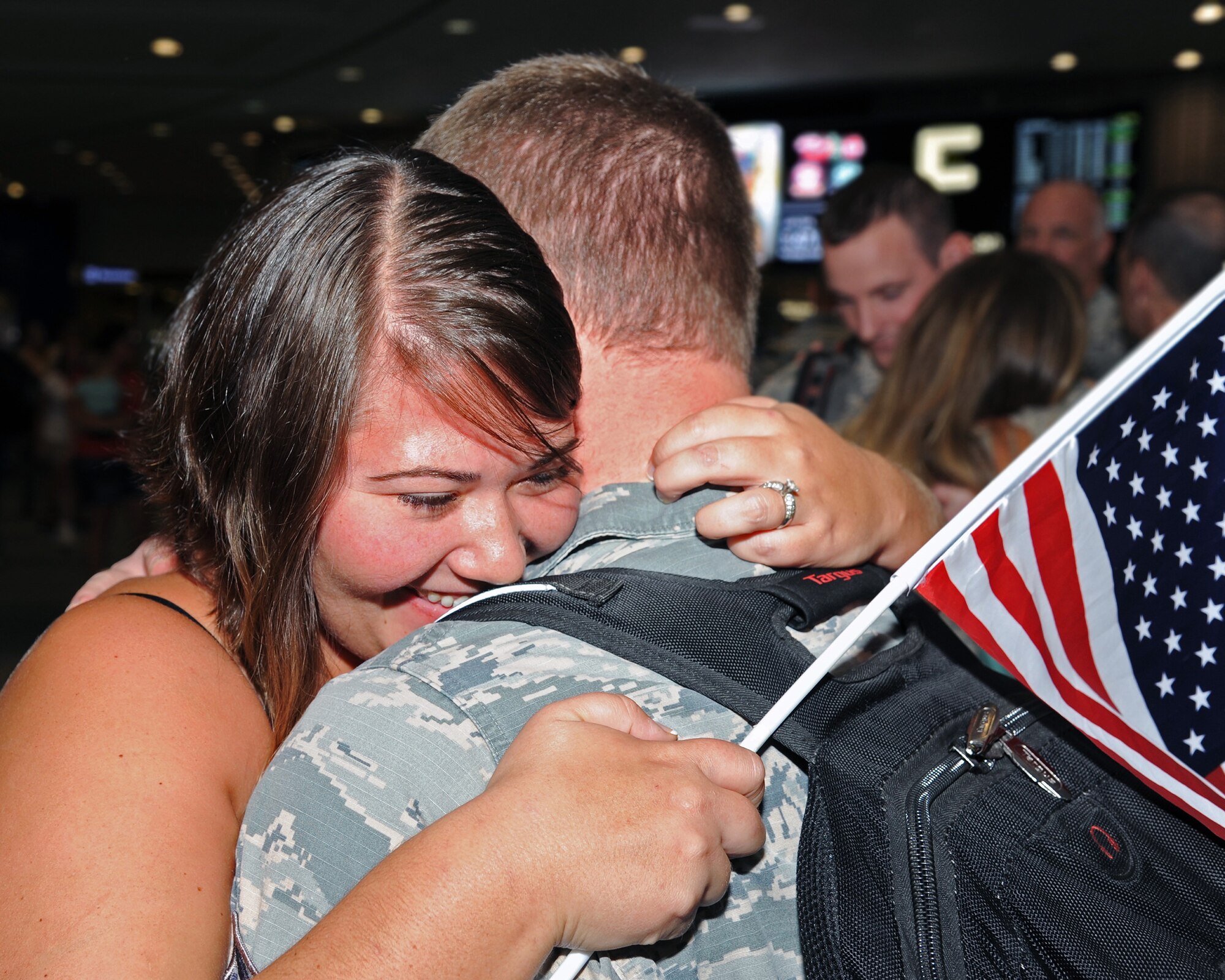 More than two dozen, family members, friends and well-wishers gathered at Tampa International Airport, October 15, to welcome home the first wave of 927 Security Forces Squadron redeployers. During the six month long deployment to an undisclosed location in Southwest Asia, the defenders provided air base defense, force protection and performed anti-terrorism duties. (U.S. Air Force photo/Tech. Sgt. Peter Dean)