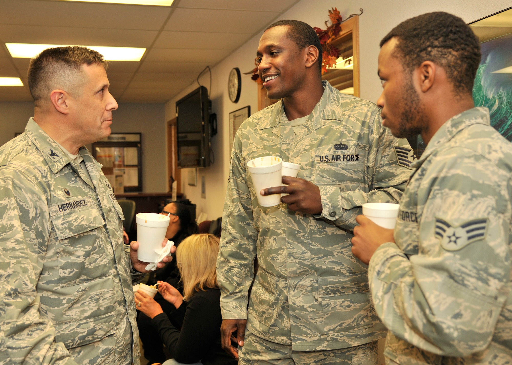 Col. Anthony Hernandez, 319th Mission Support Group commander, chats with Airmen at the Airman and Family Readiness Center Soup Supper on Grand Forks Air Base, North Dakota, Oct. 15, 2015. The annual event featured different homemade soups from base residents. (U.S. Air Force photo by Senior Airman Xavier Navarro/Released)