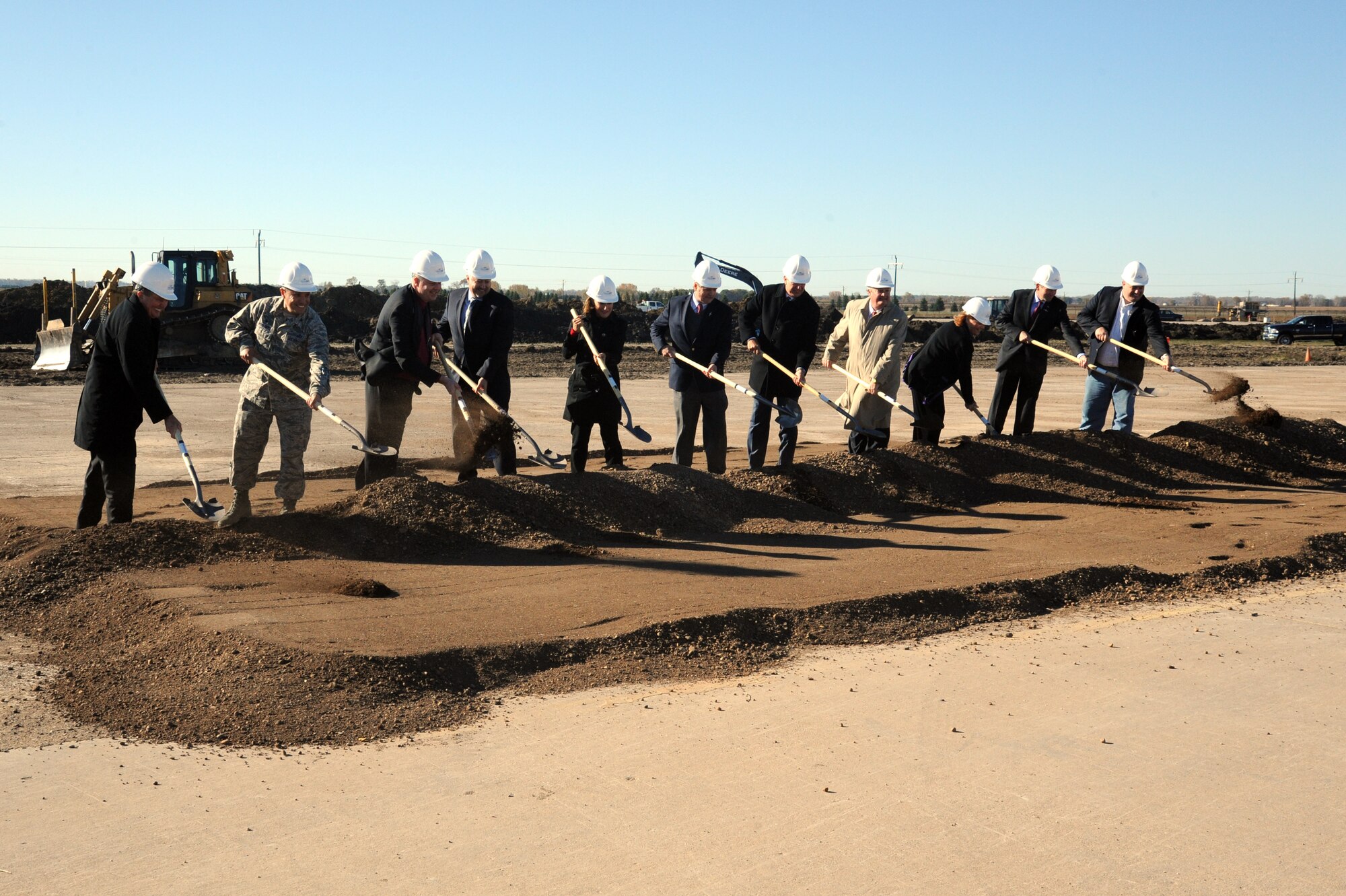 State and federal representatives, corporate executives and military leaders ceremoniously break ground for the Northrup Grumman complex on the Grand Sky Technology Park on Grand Forks Air Force Base, North Dakota, October 15, 2015. The planned complex is the first to begin construction and represents a $10 million investment. (U.S. Air Force photo by Tech. Sgt. David Dobrydney/released)