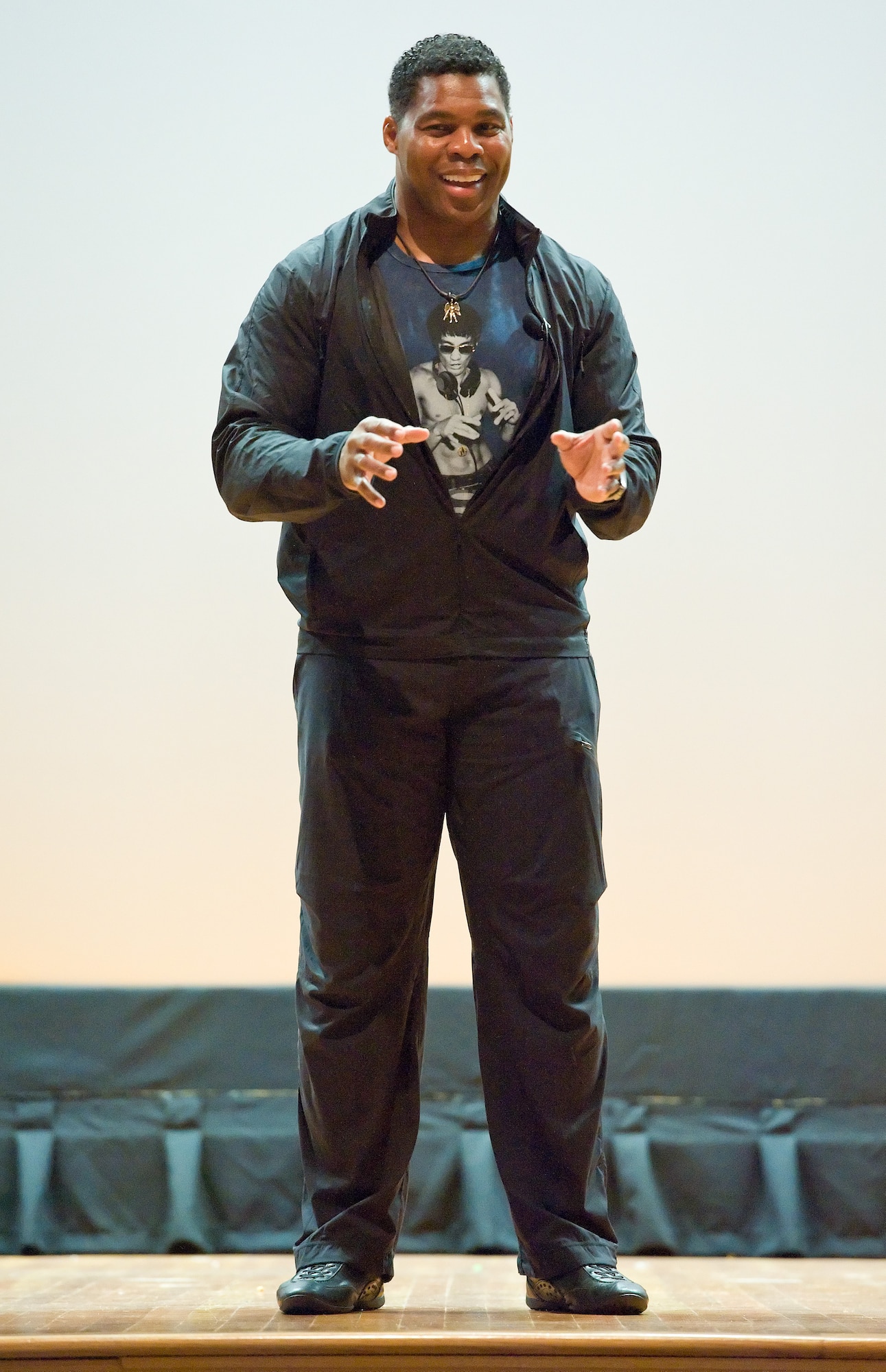 Former NFL running back and 1982 Heisman Trophy winner Herschel Walker speaks to Team Dover members on Wingman Day, Oct. 14, 2015, at the base theater on Dover Air Force Base, Del. The Patriot Support Program's Anti-stigma campaign and Walker came to spread his message of There is no shame in getting help. I did. to Team Dover members during Wingman Day by telling service members their treatment begins at that point for them and their families. (U.S. Air Force photo/Roland Balik)