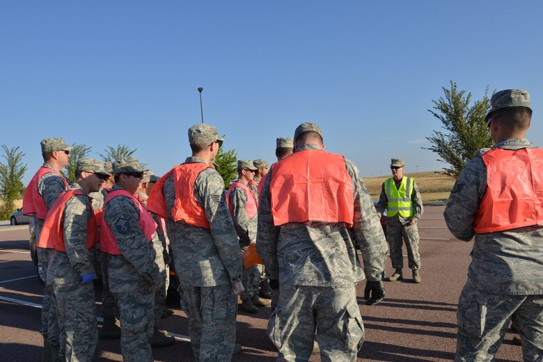Tech. Sgt. Daniel Patrick, 25th Space Range Squadron, instructs fellow volunteers, Friday, Oct. 9, 2015, before road cleanup at the Schriever Air Force Base Visitor Center. (U.S. Air Force photo/Monique Fontenot)