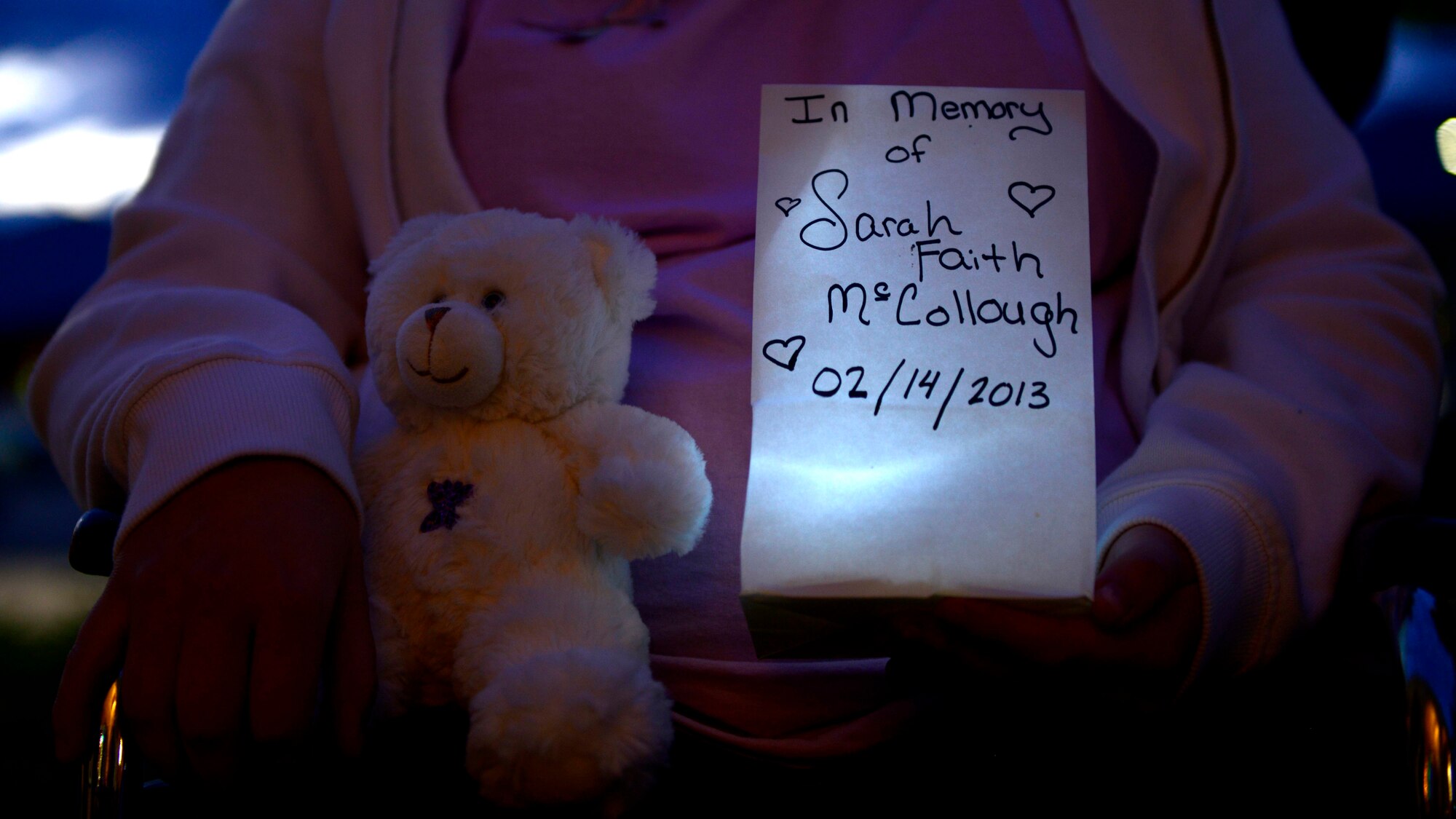 The McCollough family remembers their loved one Sarah during the Airborne Angel: Child and Pregnancy Loss group’s Wave of Light Memorial Walk, Oct. 15, 2015 at Aviano Air Base, Italy. Attendees paid tribute to their loved ones during the “Wave of Light,” which is an hour of silence to honor those families who have suffered the loss of a child. (U.S. Air Force photo by Senior Airman Areca T. Bell/Released)