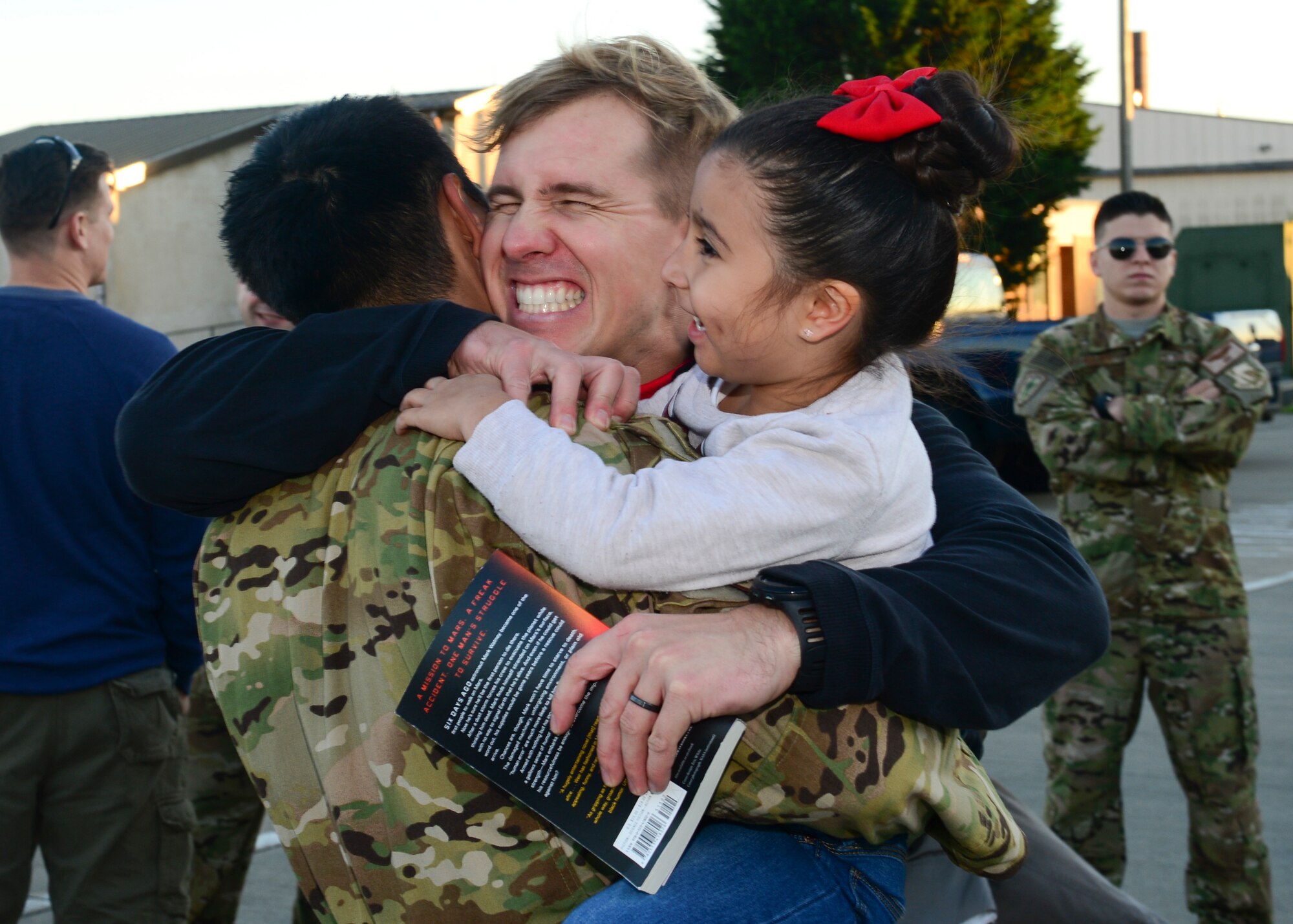 Family members gather on the RAF Lakenheath flightline Sept. 30, 2015, to welcome back Airmen of the 56th Rescue Squadron as they return from a deployment. The 56th and 57th RQSs deployed pilots, special mission aviators, pararescuemen and combat rescue officers, along with HH-60G Pave Hawk helicopters, supported by maintainers from various squadrons across the 48th Maintenance Group. (U.S. Air Force photo by Senior Airman Nigel Sandridge/Released)