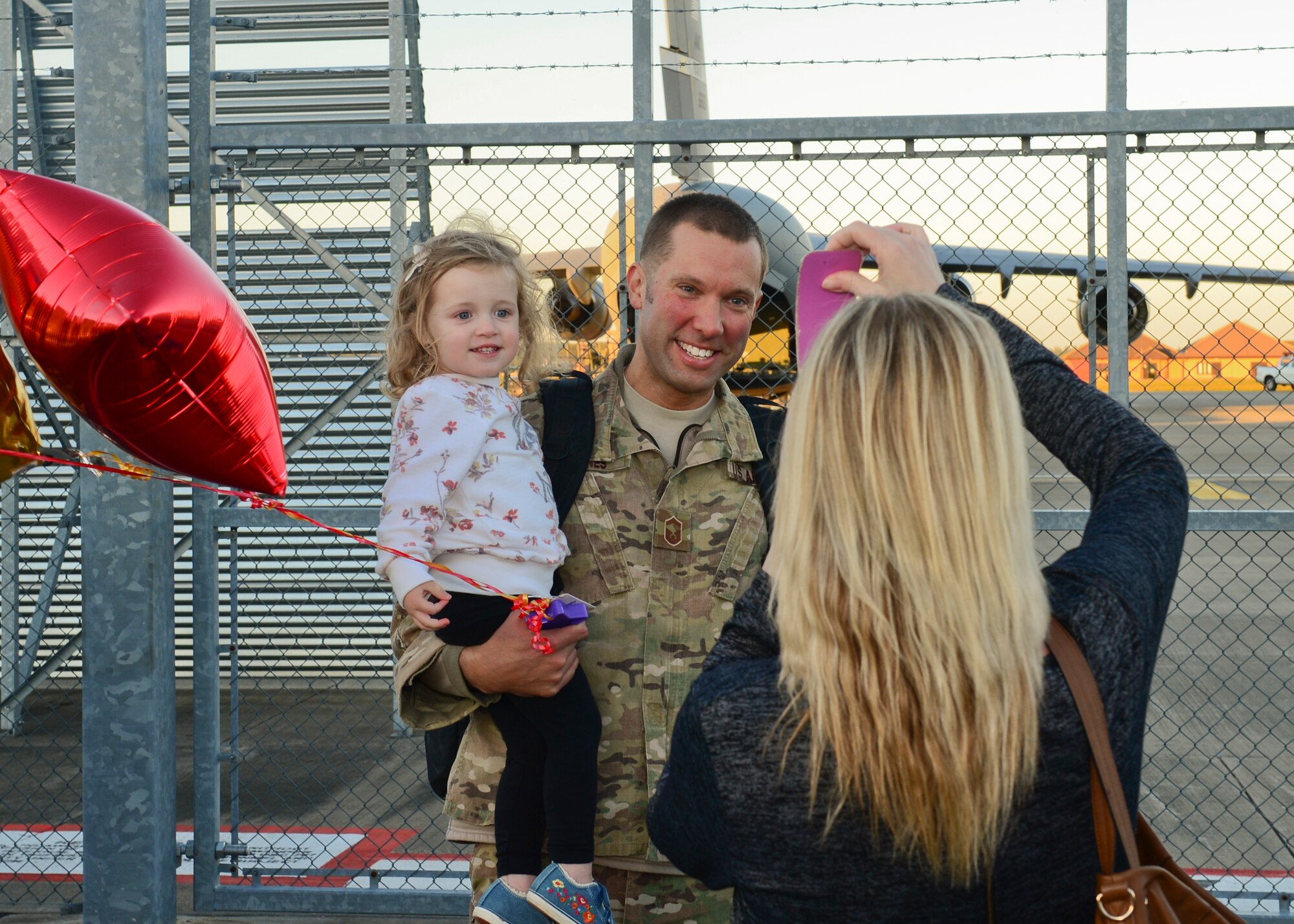 Family members gather on the RAF Lakenheath flightline Sept. 30, 2015, to welcome back Airmen of the 56th Rescue Squadron as they return from a deployment. The 56th and 57th RQSs deployed pilots, special mission aviators, pararescuemen and combat rescue officers, along with HH-60G Pave Hawk helicopters, supported by maintainers from various squadrons across the 48th Maintenance Group. (U.S. Air Force photo by Senior Airman Nigel Sandridge/Released)