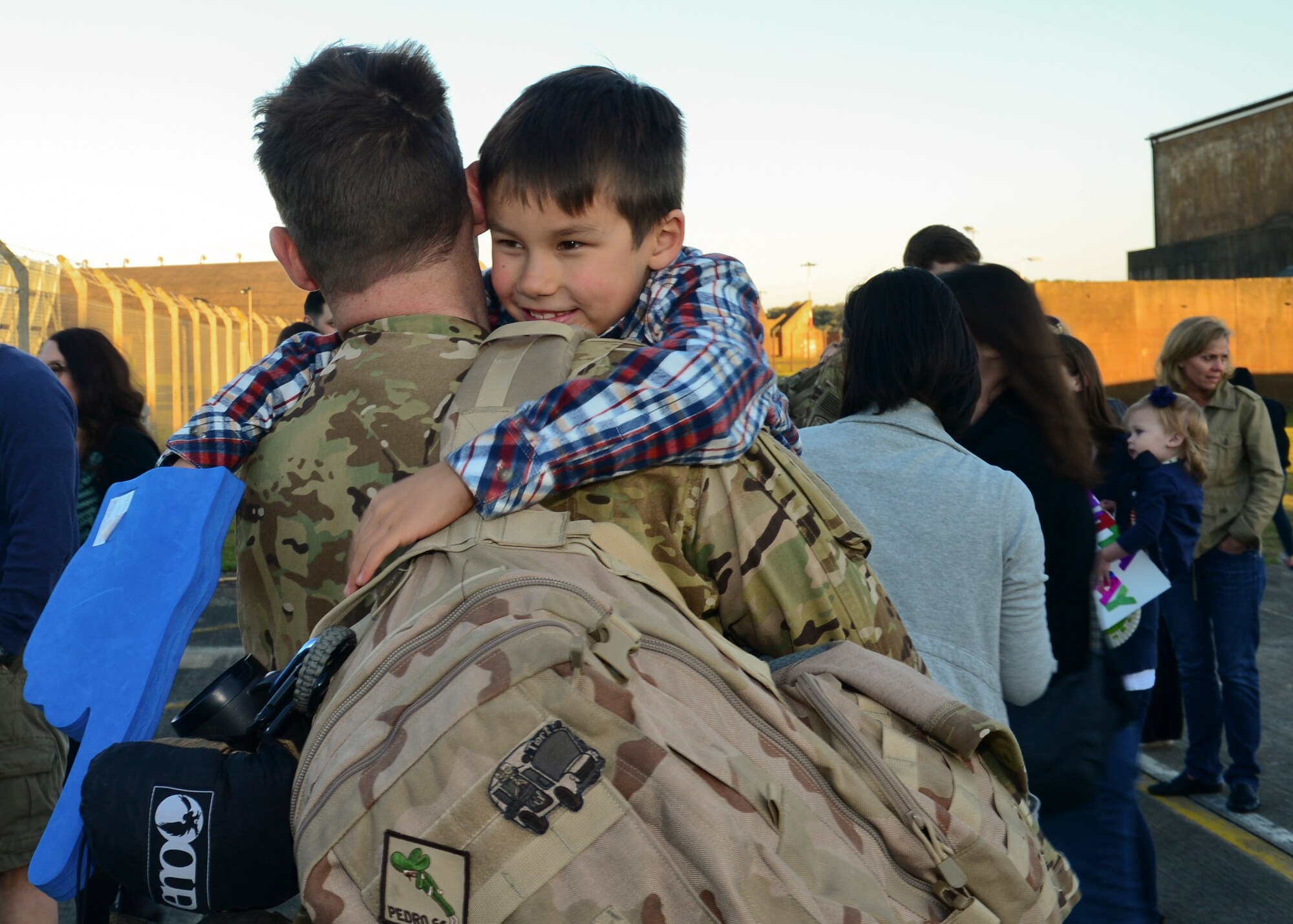 Family members gather on the RAF Lakenheath flightline Sept. 30, 2015, to welcome back Airmen of the 56th Rescue Squadron as they return from a deployment. The 56th and 57th RQSs deployed pilots, special mission aviators, pararescuemen and combat rescue officers, along with HH-60G Pave Hawk helicopters, supported by maintainers from various squadrons across the 48th Maintenance Group. (U.S. Air Force photo by Senior Airman Nigel Sandridge/Released)