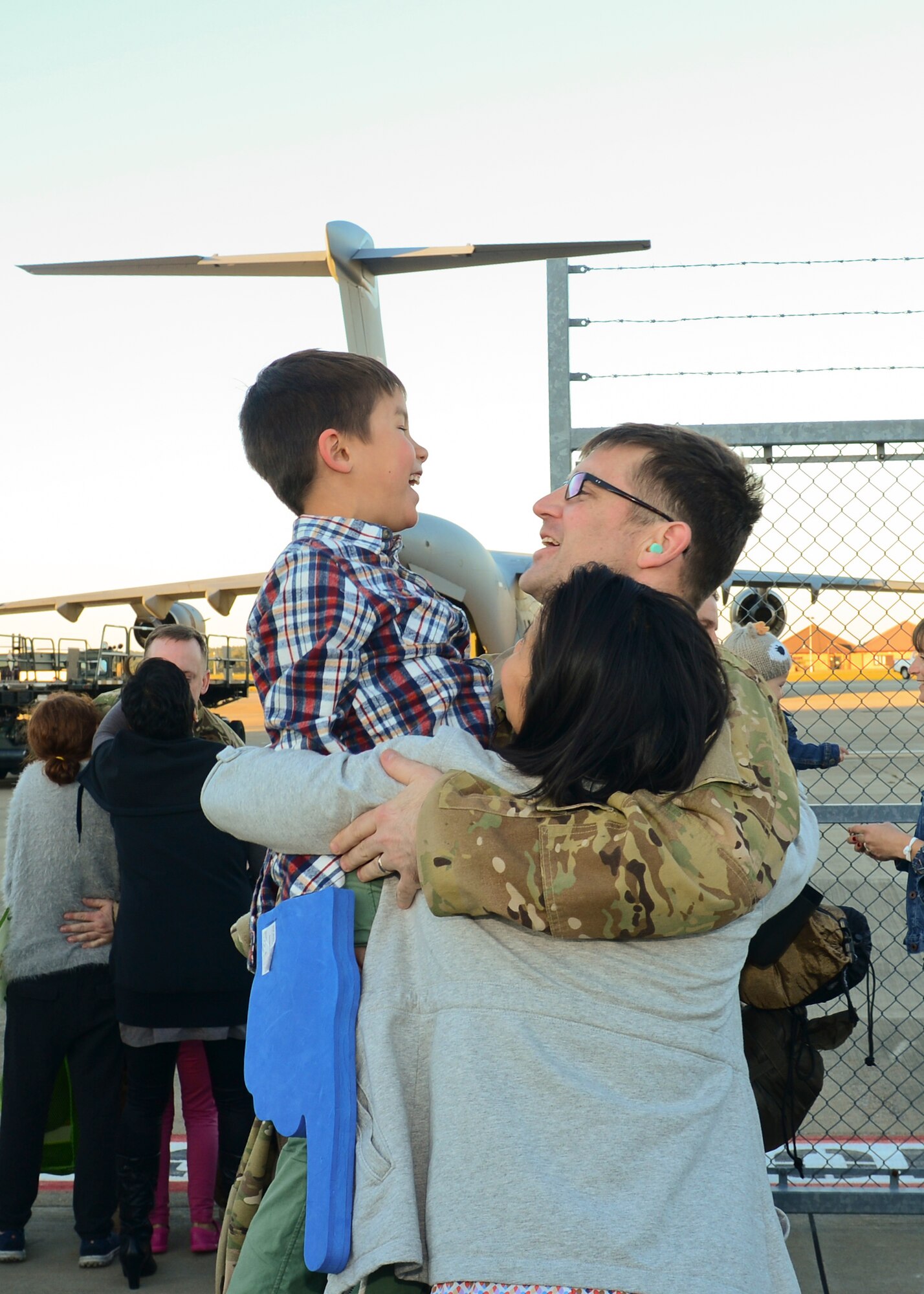 Family members gather on the RAF Lakenheath flightline Sept. 30, 2015, to welcome back Airmen of the 56th Rescue Squadron as they return from a deployment. The 56th and 57th RQSs deployed pilots, special mission aviators, pararescuemen and combat rescue officers, along with HH-60G Pave Hawk helicopters, supported by maintainers from various squadrons across the 48th Maintenance Group. (U.S. Air Force photo by Senior Airman Nigel Sandridge/Released)