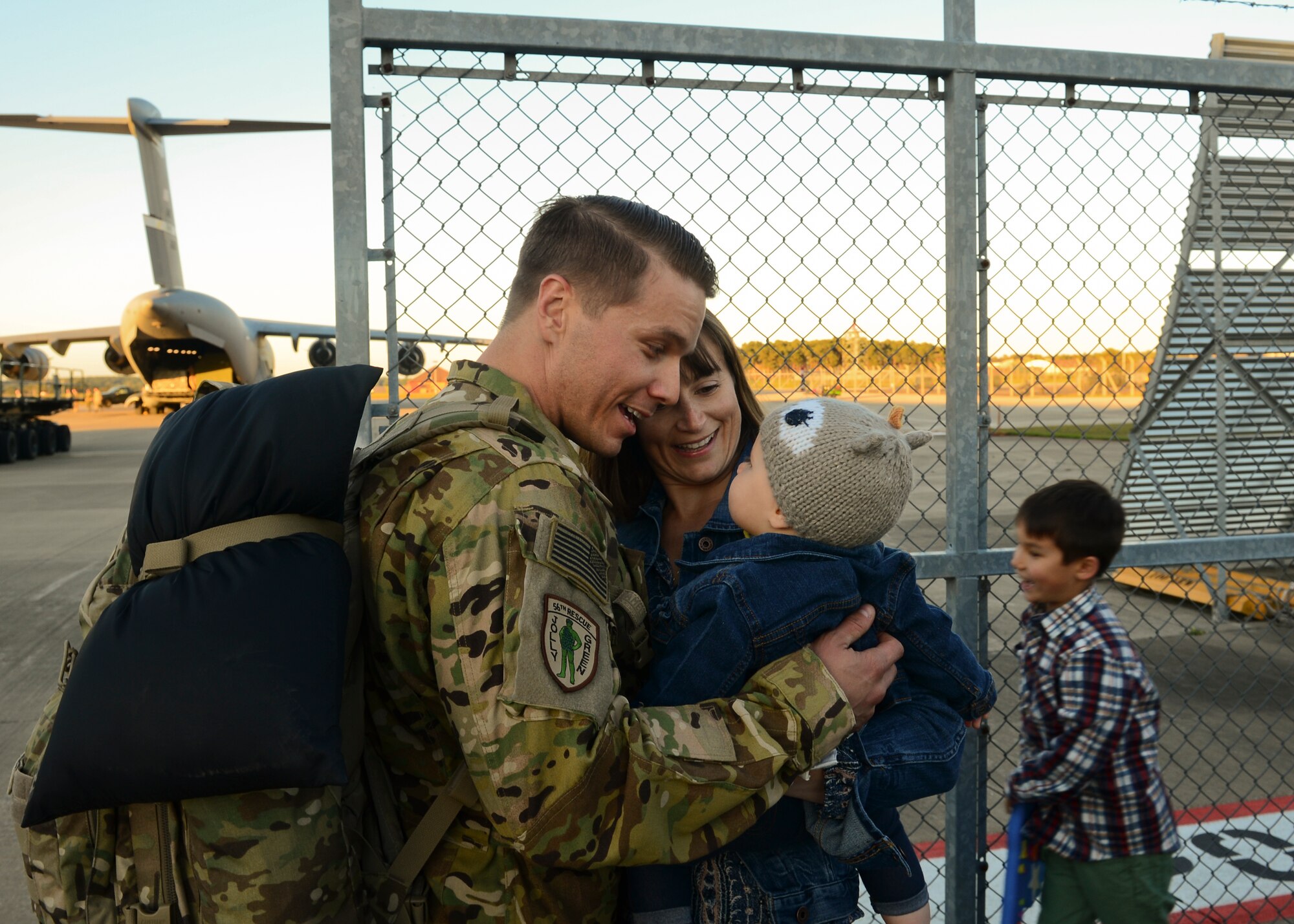 Family members gather on the RAF Lakenheath flightline Sept. 30, 2015, to welcome back Airmen of the 56th Rescue Squadron as they return from a deployment. The 56th and 57th RQSs deployed pilots, special mission aviators, pararescuemen and combat rescue officers, along with HH-60G Pave Hawk helicopters, supported by maintainers from various squadrons across the 48th Maintenance Group. (U.S. Air Force photo by Senior Airman Nigel Sandridge/Released)
