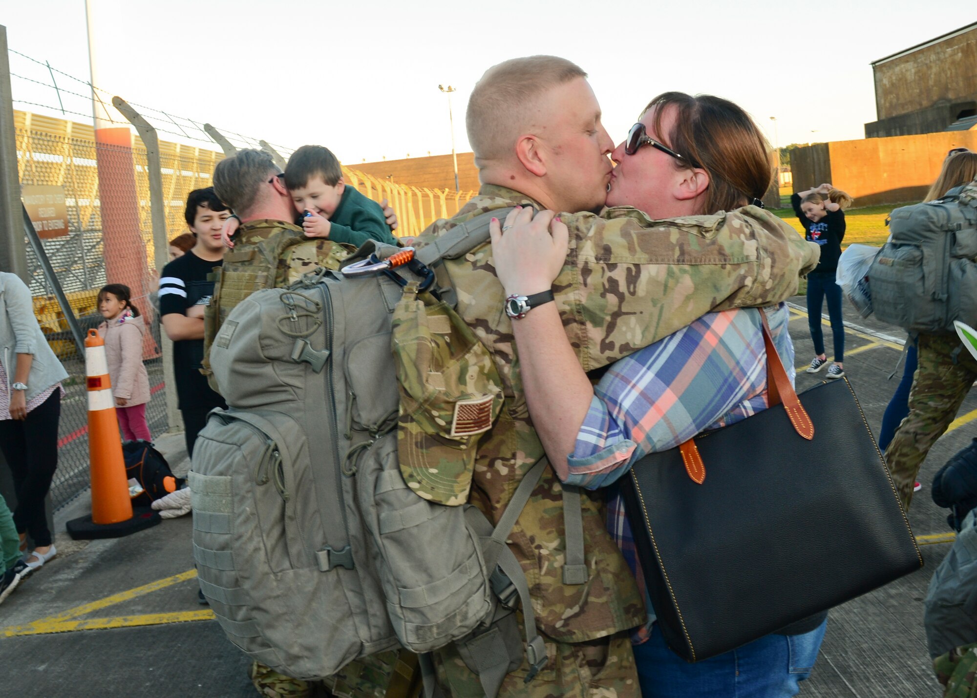 Family members gather on the RAF Lakenheath flightline Sept. 30, 2015, to welcome back Airmen of the 56th Rescue Squadron as they return from a deployment. The 56th and 57th RQSs deployed pilots, special mission aviators, pararescuemen and combat rescue officers, along with HH-60G Pave Hawk helicopters, supported by maintainers from various squadrons across the 48th Maintenance Group. (U.S. Air Force photo by Senior Airman Nigel Sandridge/Released)