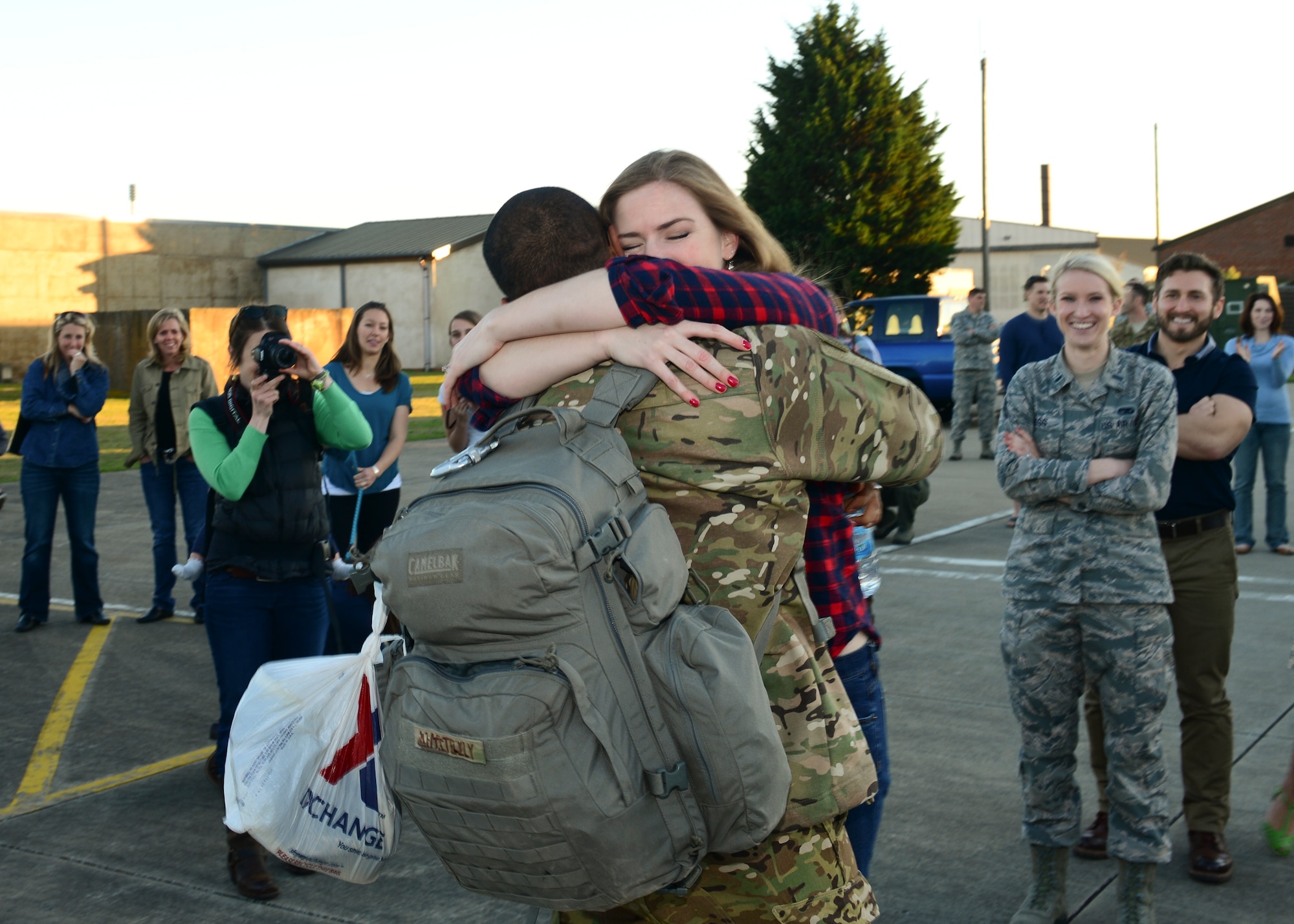 Family members gather on the RAF Lakenheath flightline Sept. 30, 2015, to welcome back Airmen of the 56th Rescue Squadron as they return from a deployment. The 56th and 57th RQSs deployed pilots, special mission aviators, pararescuemen and combat rescue officers, along with HH-60G Pave Hawk helicopters, supported by maintainers from various squadrons across the 48th Maintenance Group. (U.S. Air Force photo by Senior Airman Nigel Sandridge/Released)