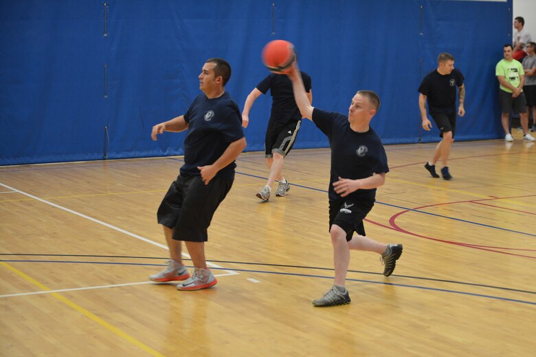 Staff Sgt. Jared Bavender, First Term Airman Center NCO-in-charge, throws a dodgeball during the Combined Federal Campaign dodgeball tournament at the Fitness Center Oct. 13, 2015 on Buckley Air Force Base, Colo. Seventeen teams signed up to compete in the tournament, which helped raise more than $400. (U.S. Air Force photo by Staff Sgt. Darren Scott/Released)