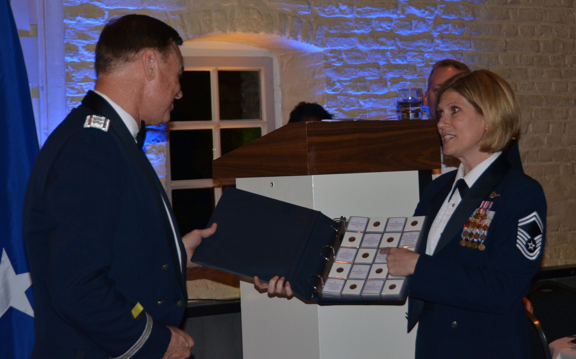 Air Force District of Washington Commander Maj. Gen. Darryl Burke is
presented with a token of gratitude by the senior enlisted leadership at
Geilenkirchen, Germany during the Tri-Border U.S. Air Force Ball Oct. 9,
2015. Burke, Commander of NATO's E3-A Component Flying Squadron One from
2001-2003, spoke about the rich history of the U.S. Air Force and how Airmen
of today are rising to the occasion to confront future challenges. AFDW
provides full-spectrum operational support including personnel, legal,
financial, contracting, and aircrew management to approximately 26,000
Airmen across the globe. (Courtesy Photo)
