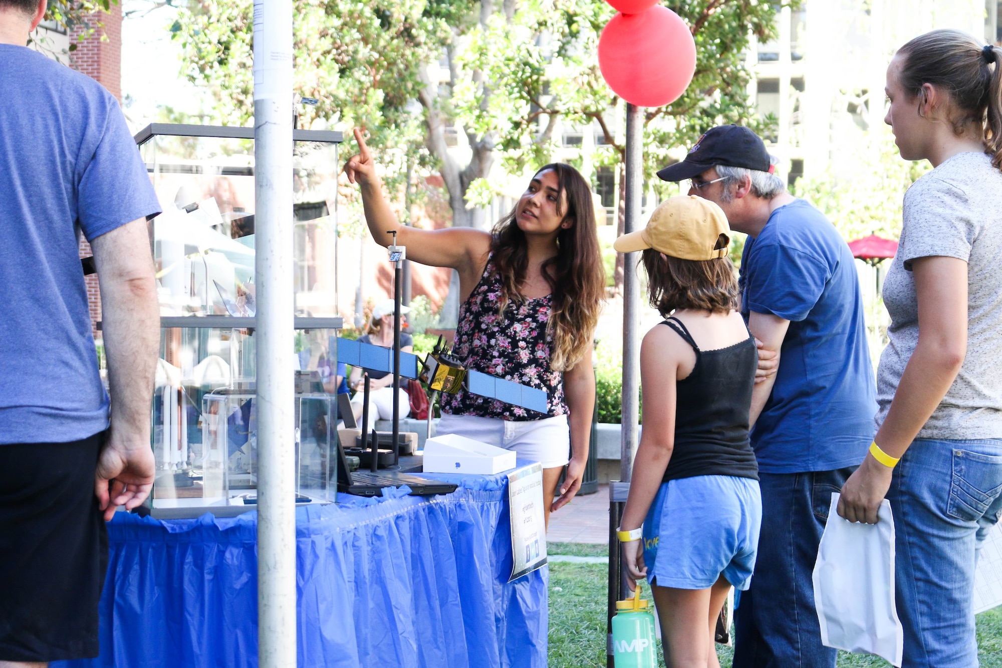 Samantha Marez, an Air Force Pathways engineering intern from the Space and Missile Systems Center’s Military Satellite Communications Systems Directorate at Los Angeles Air Force Base in El Segundo, Calif., assists students in answering science and engineering questions at the University of Southern California's Viterbi School of Engineering. The Lasers 4 Ladies event on Oct. 10 focused on demonstrating optics and photonics to over 500 middle and high school female students from across the greater Los Angeles region. (USC courtesy photo/Peter Shin) 