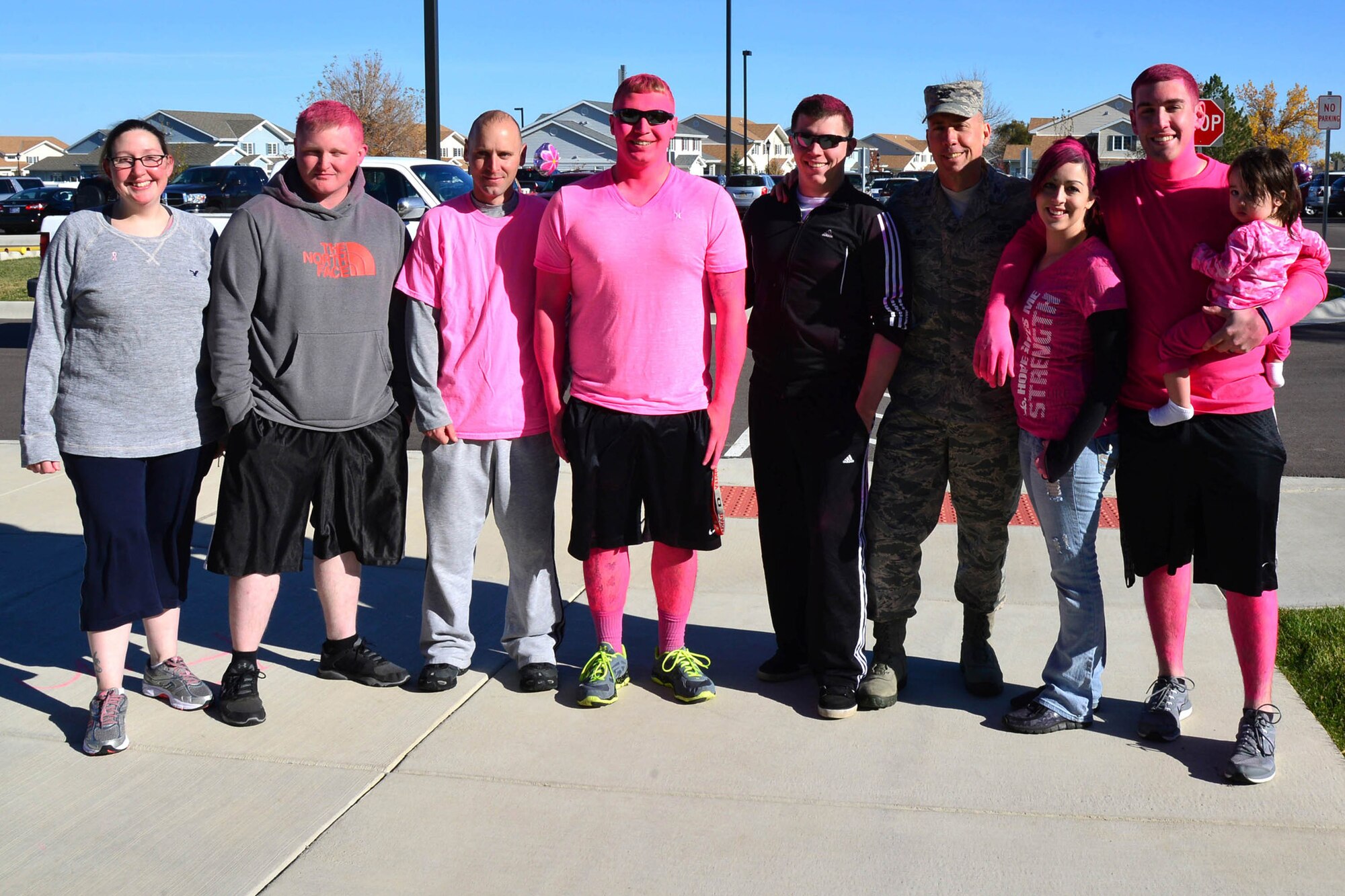 Col. Tom Wilcox, 341st Missile Wing commander, poses with a group of attendees at the breast cancer awareness walk and run Oct. 15, 2015, at Malmstrom Air Force Base, Mont. Nearly 210 people showed up to the event to show support and awareness of breast cancer. (U.S. Air Force photo/Airman Daniel Brosam)