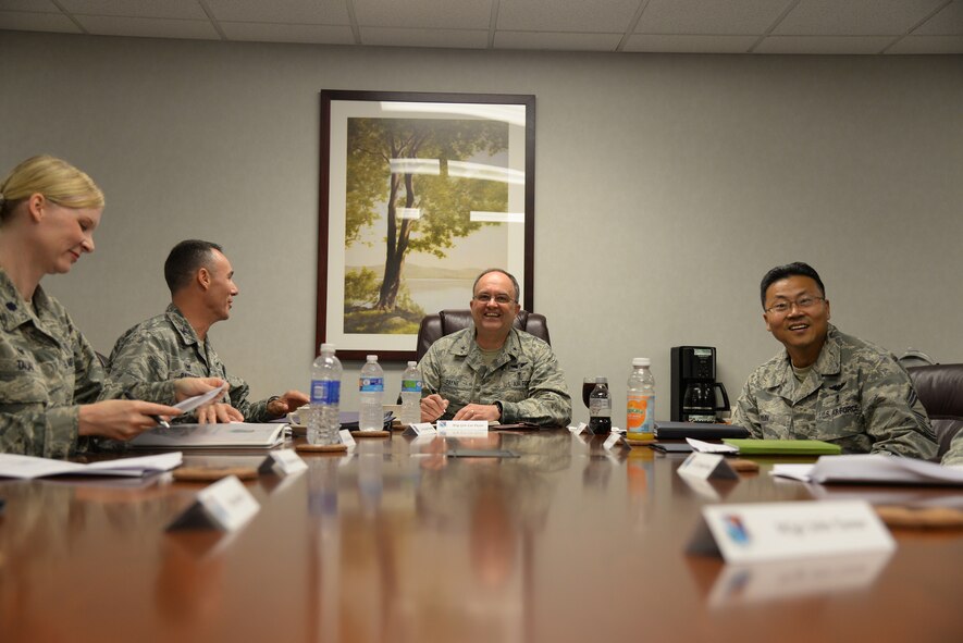 Brig. Gen. Lee Payne, center, Air Force Medical Operations Agency commander attends a 47th Medical Group mission brief at Laughlin Air Force Base, Texas, Oct. 15, 2015. . Payne visited Laughlin to get a first-hand look at the mission and to interact with 47th Medical Group Airmen.  (U.S. Air Force photo by Airman 1st Class Brandon May) (Released)

