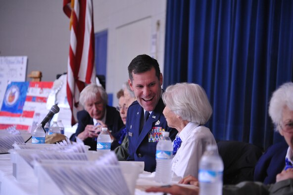 Col. John Devillier (left), 88th Air Base Wing commander, shares a laugh with Marty Wyall (right), a member of the Women Airforce Service Pilots (WASP) during an Oct. 9 assembly to honor Caro Bayley Bosco. The WASP were instrumental in U.S. efforts during World War II , and were responsible for delivering thousands of aircraft, ranging from fighters to bombers, to units around the world. (U.S. Air Force photos/Gina Giardina)