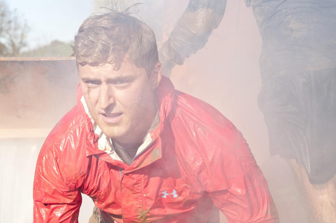 COATESVILLE, Penn. - A Tough Mudder crawls through an obstacle during the Tough Mudder Philly event Oct. 17 in Coatesville, Penn. The U.S. Army Reserve was one of the sponsors for the event. (U.S. Army photo by Sgt. Hector Membrano)