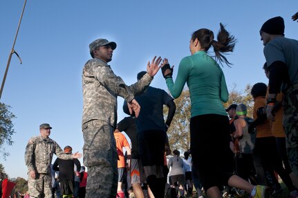 COATESVILLE, Penn. - U.S. Army Reserve Soldiers give encouragement to Tough Mudders as they begin the course at Tough Mudder Philly in Coatesville, Penn., Oct. 17. The U.S. Army Reserve was one of the sponsors for the event. (U.S. Army photo by Staff Sgt. Debralee Best)