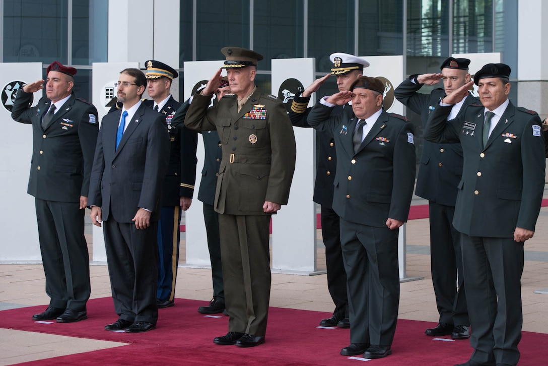 U.S. Marine Corps Gen. Joseph F. Dunford Jr., center, chairman of the Joint Chiefs of Staff, and Lt. Gen. Gadi Eizenkot, second right, the commander-in-chief of the Israeli Defense Force, participate in an official welcoming ceremony at the Israeli Defense Forces military headquarters in Tel Aviv, Israel, Oct. 18, 2015. DoD photo by D. Myles Cullen