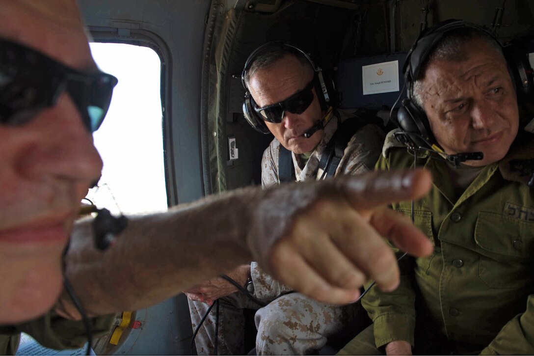 U.S. Marine Corps Gen. Joseph F. Dunford Jr., chairman of the Joint Chiefs of Staff, receives a briefing on board an Israeli helicopter above northern Israel, Oct. 18, 2015. DoD photo by D. Myles Cullen