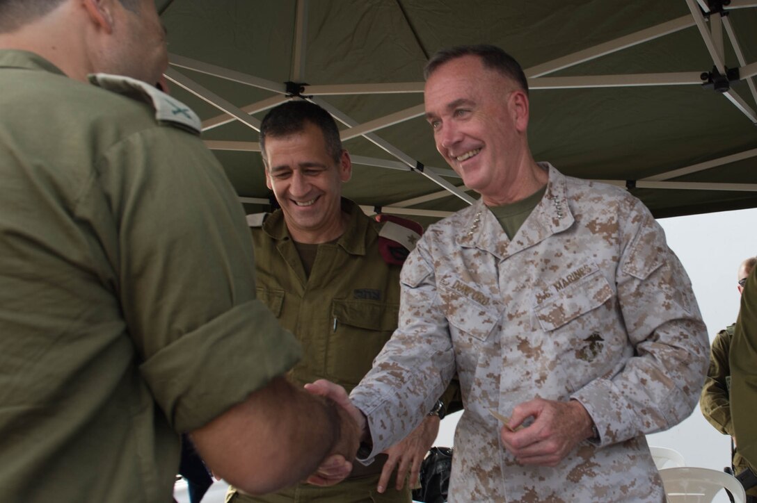 U.S. Marine Corps Gen. Joseph F. Dunford Jr., chairman of the Joint Chiefs of Staff, shakes hands with an Israeli Soldier in northern Israel, Oct. 18, 2015. DoD photo by D. Myles Cullen