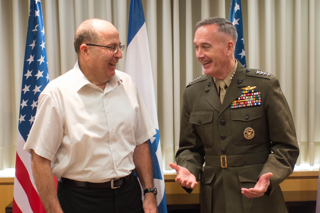 U.S. Marine Corps Gen. Joseph F. Dunford Jr., chairman of the Joint Chiefs of Staff, shares a light moment with Israeli Defense Minister Moshe Yaalon while meeting at the Israeli Defense Forces military headquarters in Tel Aviv, Israel, Oct. 18, 2015. DoD photo by D. Myles Cullen