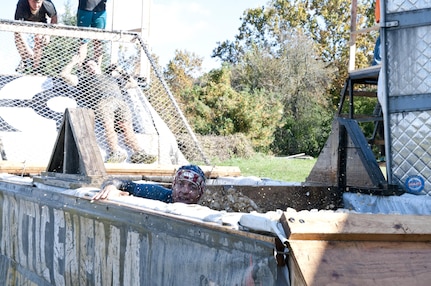 COATESVILLE, Penn. - A Tough Mudder comes up from the icy water of the Arctic Enema during the Tough Mudder Philly course in Coatesville, Penn., Oct. 18. The U.S. Army Reserve was one of the sponsors for the event.(U.S. Army photo by Staff Sgt. Debralee Best)