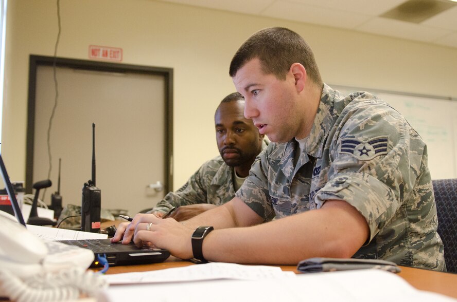 Tech Sgt. Spencer Walcot (left), a command support staff member for the Kentucky Air National Guard’s 123rd Civil Engineer Squadron, and Senior Airman Clinton Cecil (right), an operations management specialist for the 123rd CES, provide communications links during a civil engineering training exercise held at March Air Reserve Base, Calif., on June 11, 2015. The exercise was designed to simulate a real-world mission. (U.S. Air National Guard photo by Senior Airman Joshua Horton)
