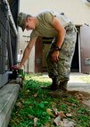 Airman 1st Class Evan Evans, 51st Civil Engineer Squadron heating, ventilation, and air conditioning technician, opens a valve to release water from pipes on Osan Air Base, Republic of Korea, Oct. 14, 2015. The Airmen from the HVAC shop are preparing the base for the upcoming winter season. Utilizing preventative maintenance during the No Heat/No Cool seasons maximizes the lifespan of HVAC systems throughout the base. (U.S. Air Force photo/Senior Airman Kristin High)