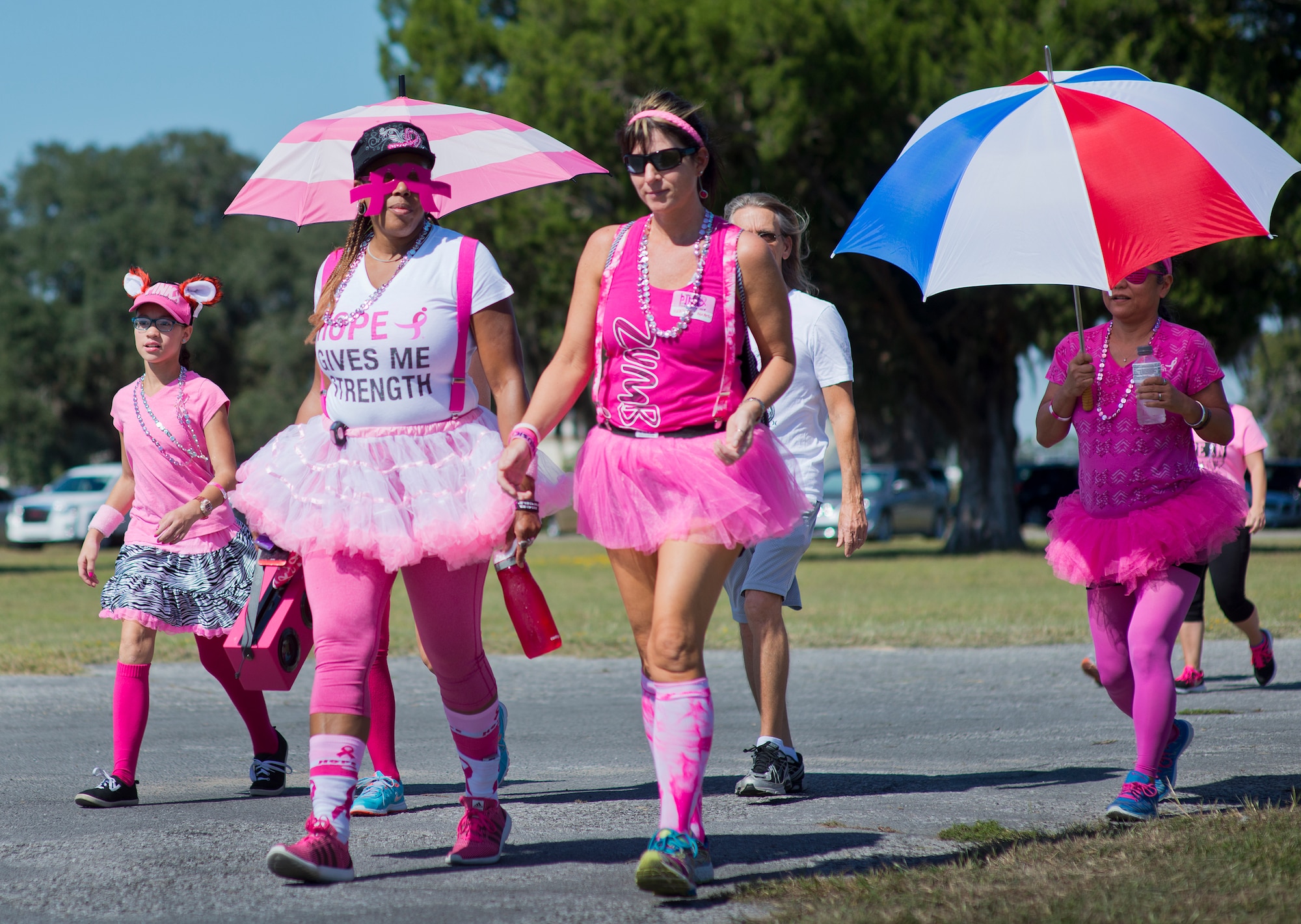 Runners dressed in pink jog to support the Eighth Annual Breast Cancer Awareness 5k run Oct. 17 at Eglin Air Force Base, Fla.  Eglin's health promotion flight was also on hand providing information on breast cancer risk factors, symptoms and screenings. The event was held to promote breast cancer awareness and the importance of self-examination to catch the disease in its early stages. More than 200 supporters came out to run.  (U.S. Air Force photo/Samuel King Jr.)