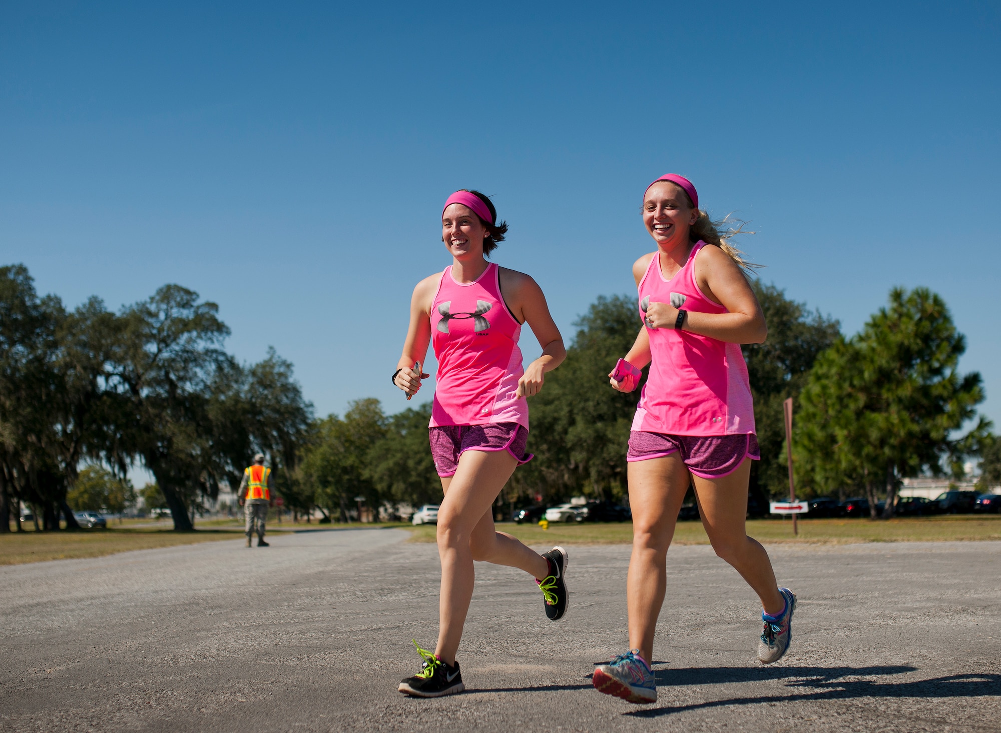 Runners dressed in pink jog to support the Eighth Annual Breast Cancer Awareness 5k run Oct. 17 at Eglin Air Force Base, Fla.  Eglin's health promotion flight was also on hand providing information on breast cancer risk factors, symptoms and screenings. The event was held to promote breast cancer awareness and the importance of self-examination to catch the disease in its early stages. More than 200 supporters came out to run.  (U.S. Air Force photo/Samuel King Jr.)