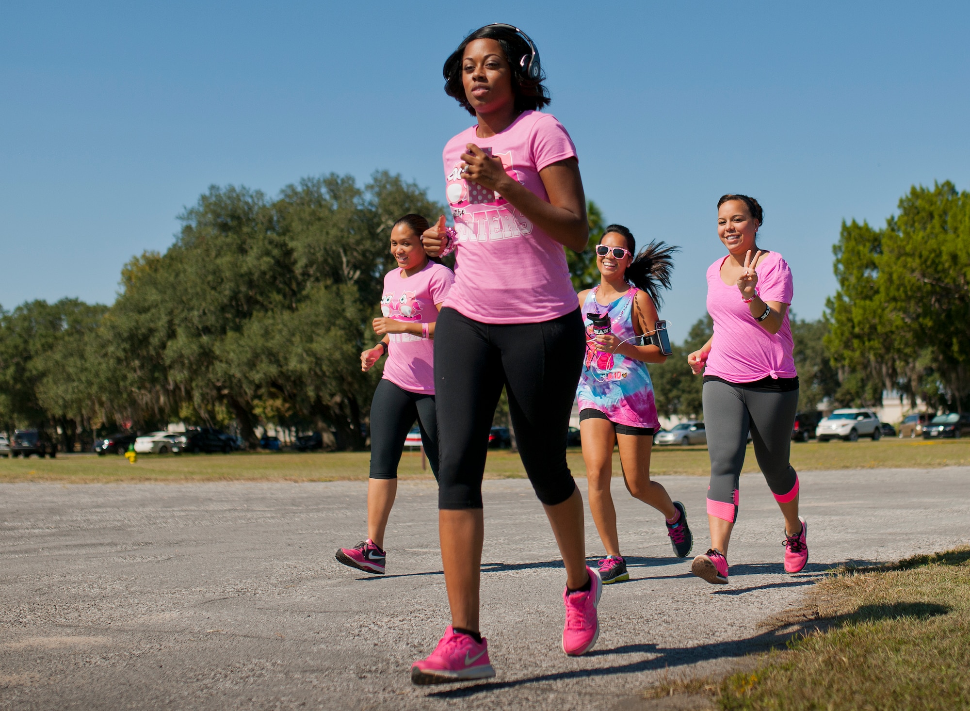 Runners dressed in pink jog to support the Eighth Annual Breast Cancer Awareness 5k run Oct. 17 at Eglin Air Force Base, Fla. Eglin's health promotion flight was also on hand providing information on breast cancer risk factors, symptoms and screenings. The event was held to promote breast cancer awareness and the importance of self-examination to catch the disease in its early stages. More than 200 supporters came out to run.  (U.S. Air Force photo/Samuel King Jr.)