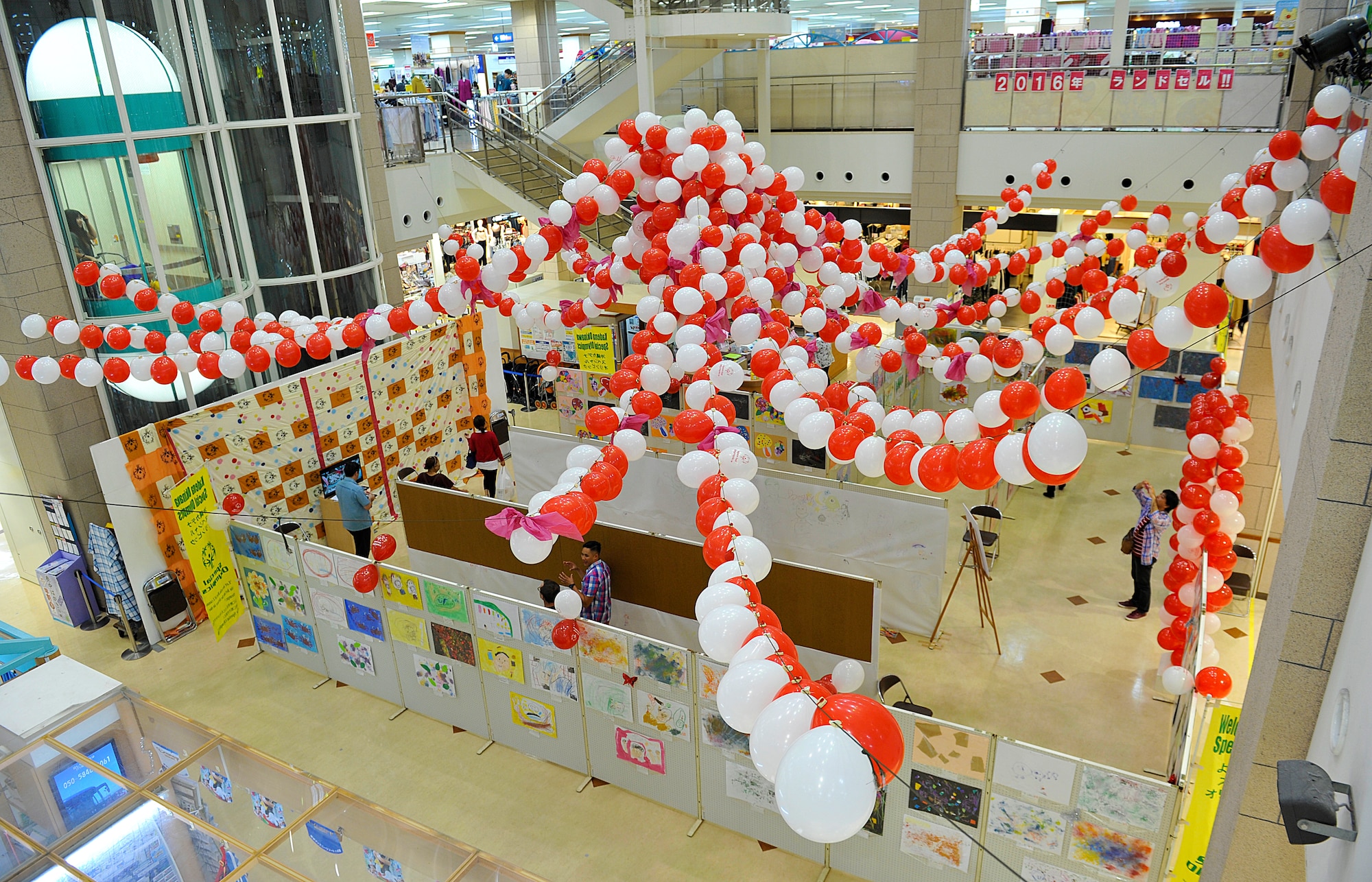 The Kadena Special Olympics committee holds an art exhibit at Main City Shopping Mall San-A in Uruma City, Oct. 16, 2015. The art exhibit, for the 16th Annual KSO, included 273 works of art created by special needs students from elementary and junior high schools in Okinawa City, Chatan, Kadena Town and Okinawa Prefectural special education schools. (U.S. Air Force photo by Naoto Anazawa)