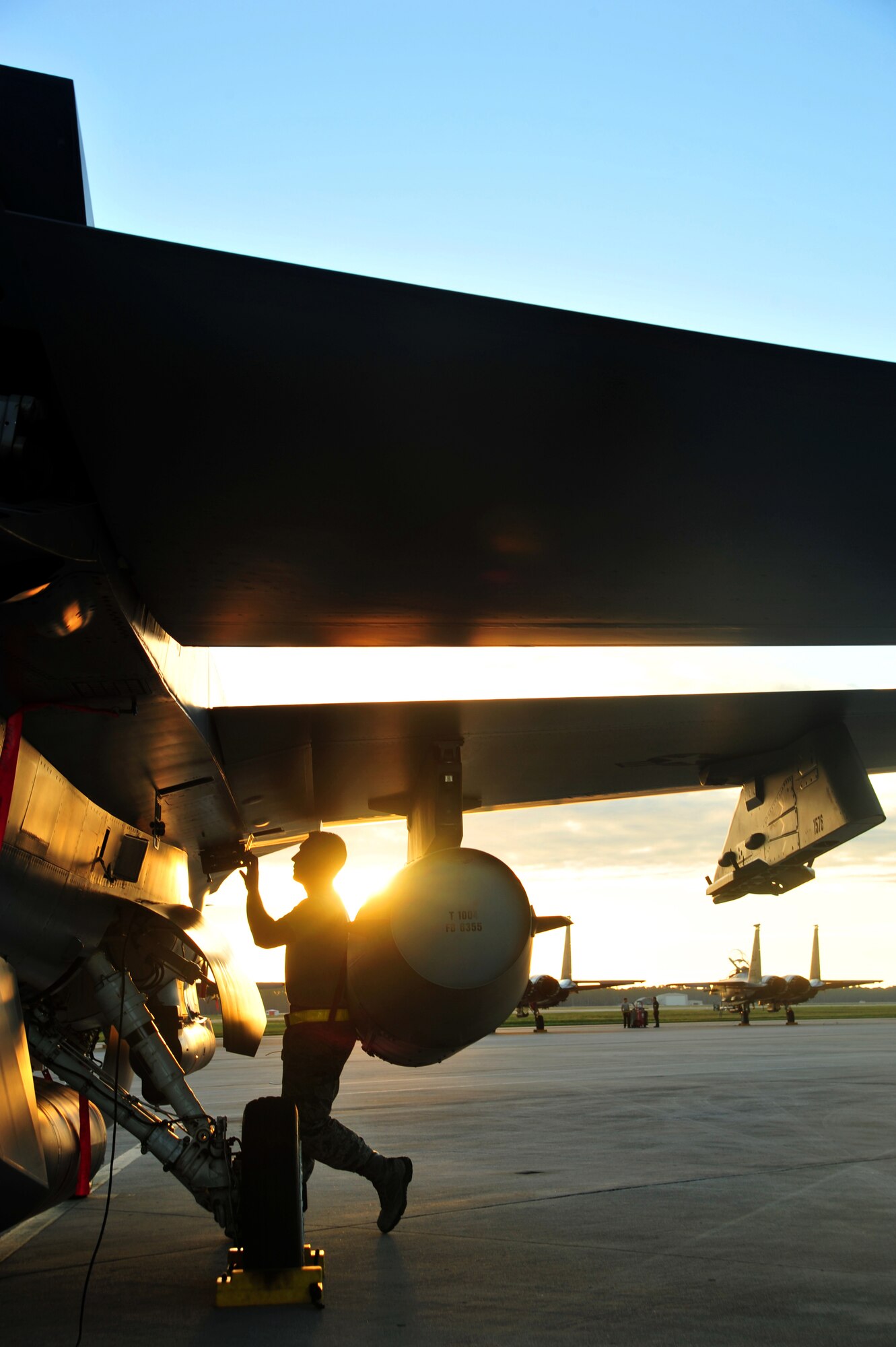Senior Airman Josh Miller, an F-16 mechanic from the 180th Fighter Wing, Ohio Air National Guard, conducts a preflight inspection on a fighter jet before an early morning a training sortie Sept. 15, at Tyndall Air Force Base, Fla. About 120 Airmen from the 180th FW traveled to Tyndall to participate in the Combat Archer exercise, a weapons system evaluation program designed to test the effectiveness of our Airmen and air-to-air weapon system capability of our F-16s and other combat aircraft. Training allows our pilots to provide a vital link for the defense of our country. Air National Guard photo by Senior Master Sgt. Beth Holliker/Released