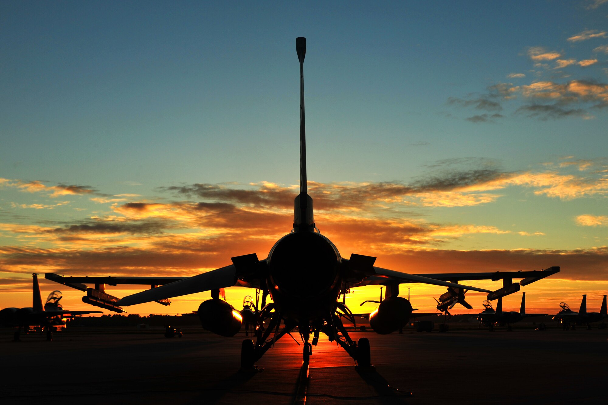 An F-16 Fighting Falcon from the 180th Fighter Wing sits on the flightline at Tyndall Air Force Base, Fla., Sept. 18, before morning sorties. About 120 Airmen from the 180th FW traveled to Tyndall Air Force Base, Fla., to participate in the Combat Archer exercise, a weapons system evaluation program designed to test the effectiveness of our Airmen and air-to-air weapon system capability of our F-16s and other combat aircraft. Training allows our pilots to provide a vital link for the defense of our country. Air National Guard photo by Senior Master Sgt. Beth Holliker/Released