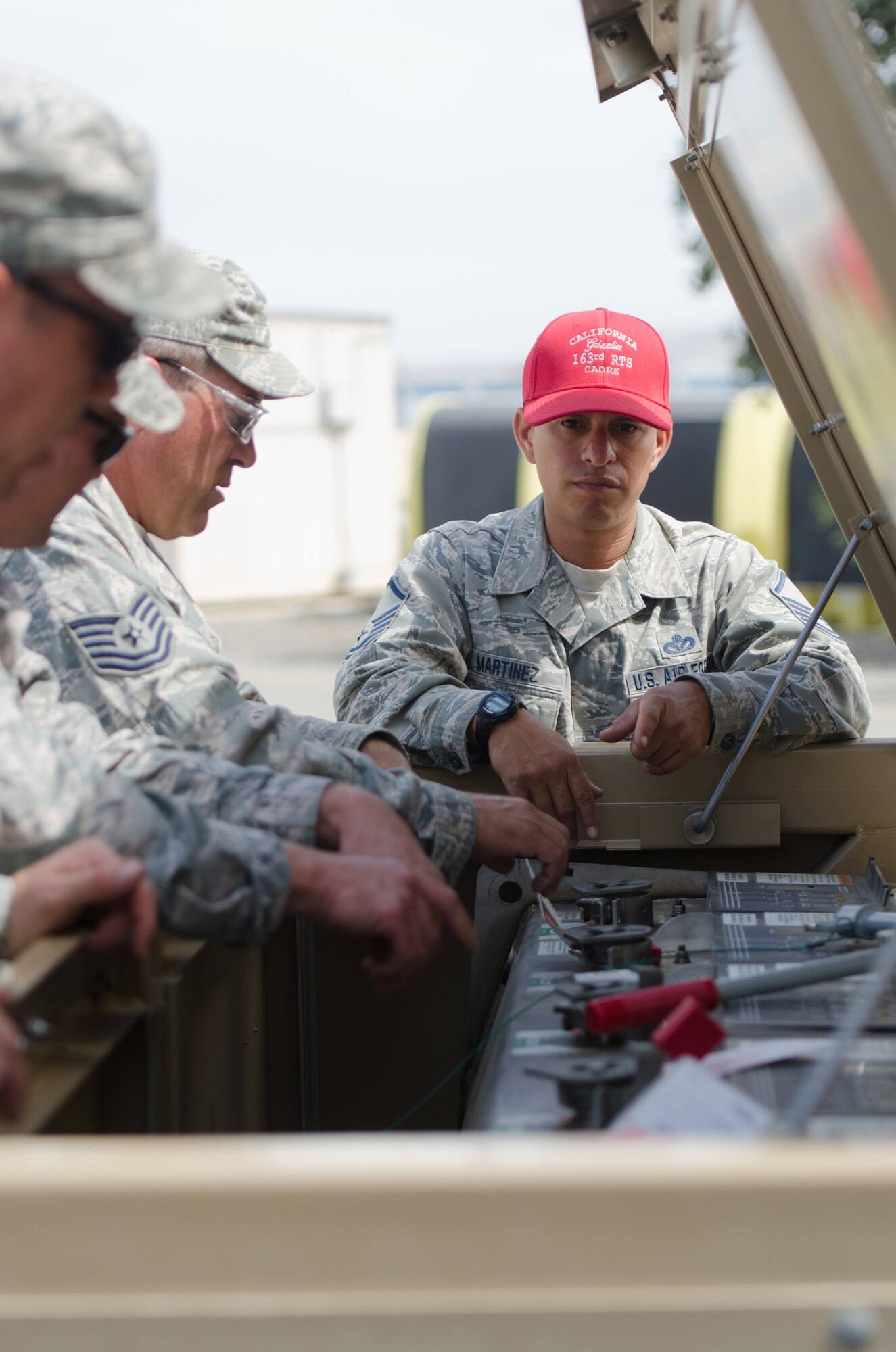 Master Sgt. Emilio Martinez, a training cadre member at March Air Reserve Base, Calif., oversees electricians from the Kentucky Air National Guard’s 123rd Civil Engineer Squadron during a training scenario there June 9, 2015. The exercise was designed to simulate a real-world mission. (U.S. Air National Guard photo by Senior Airman Joshua Horton)