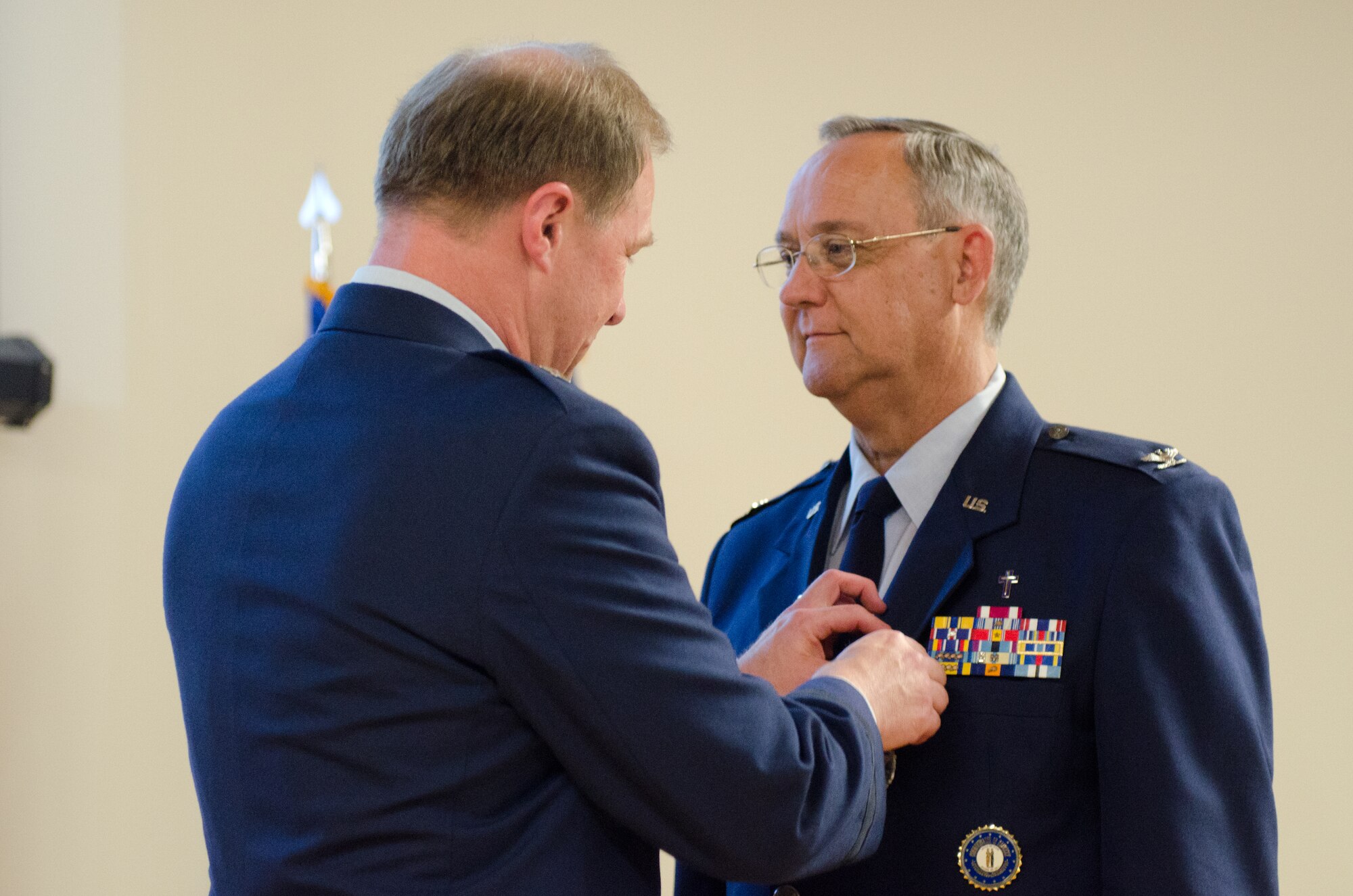 Brig. Gen. Steven P. Bullard (left), the chief of staff for Headquarters, Kentucky Air National Guard, pins Chaplain (Col.) Thomas Curry, the outgoing Air National Guard assistant to command chaplain for NORAD and USNORTHCOM, with the Defense Superior Service Medal during a ceremony at the Kentucky Air National Guard Base in Louisville, Ky. on June 6, 2015.  Curry is retiring after more than three decades of service to the Kentucky Air National Guard. (U.S. Air National Guard photo by Senior Airman Joshua Horton)