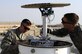 Staff Sgt. Gregory Evenson and Senior Airman David Baily, both are 386th Expeditionary Operations Support Squadron weather forecasters, conduct a preventative maintenance inspection on a Doppler radar system at an undisclosed location in Southwest Asia, Oct. 16, 2015. Forecasters use the radar equipment and traditional observation techniques to aid aircraft flying in support of Operation Inherent Resolve. (U.S. Air Force photo/Staff Sgt. Tyler Alexander)